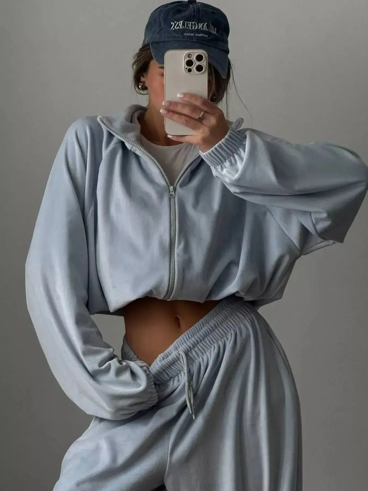 Women’s long sleeve zip-up jacket and pants lounge set by Plush Fashion Hub, casual and comfortable matching activewear.