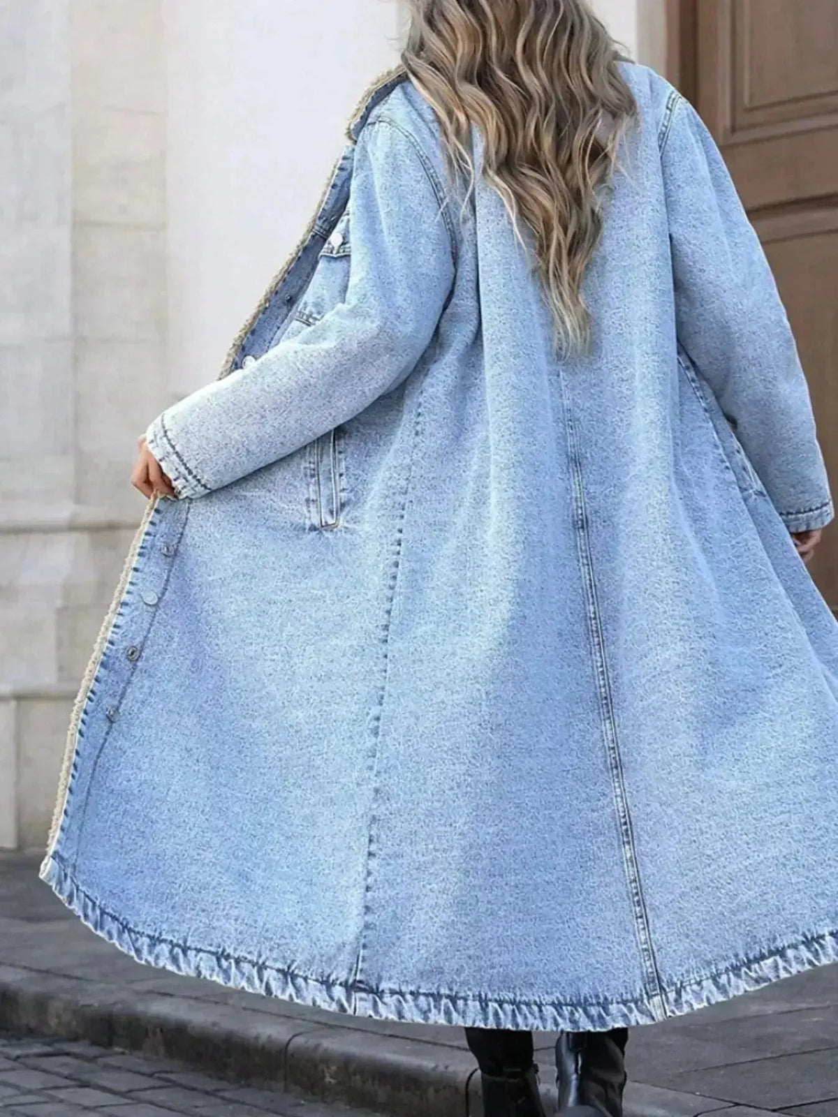 Women's longline denim jacket with plush sherpa lining, cozy fall and winter outerwear from Plush Fashion Hub.