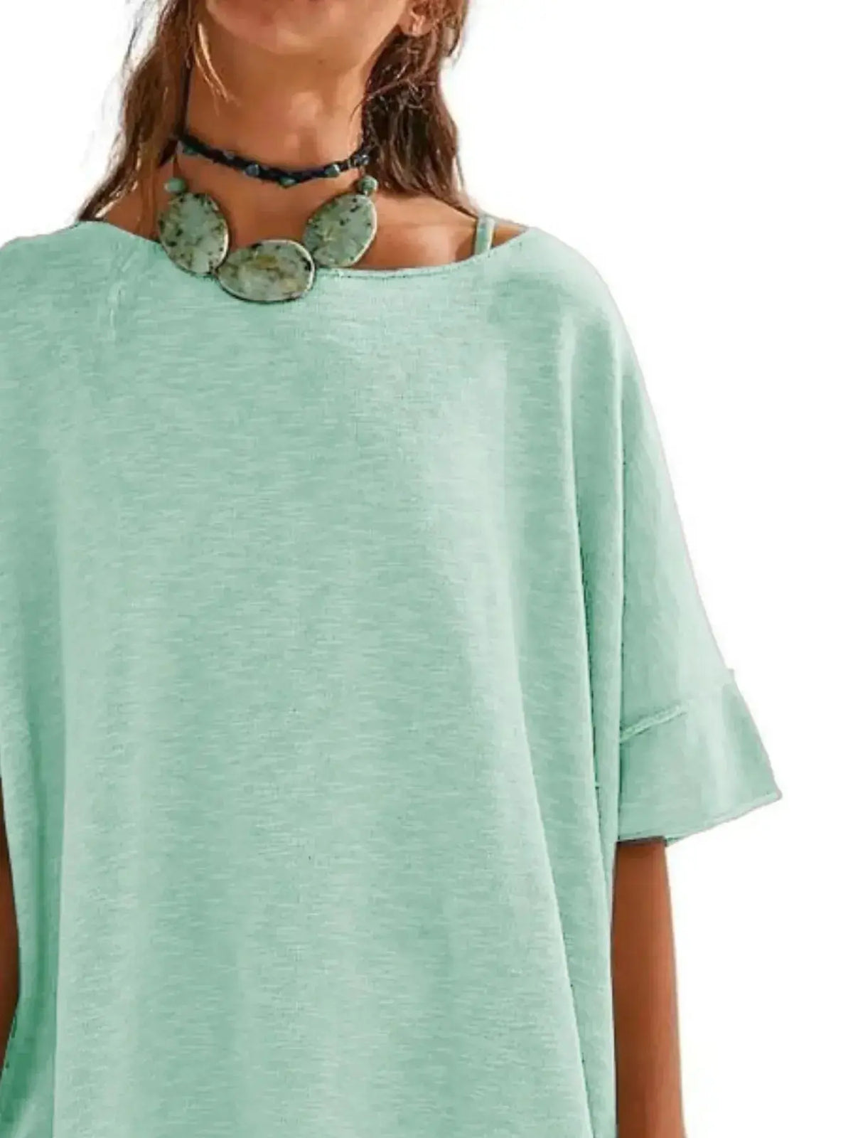 Women’s oversized drop-shoulder round neck casual T-shirt by Plush Fashion Hub, relaxed fit, soft fabric, worn casually.