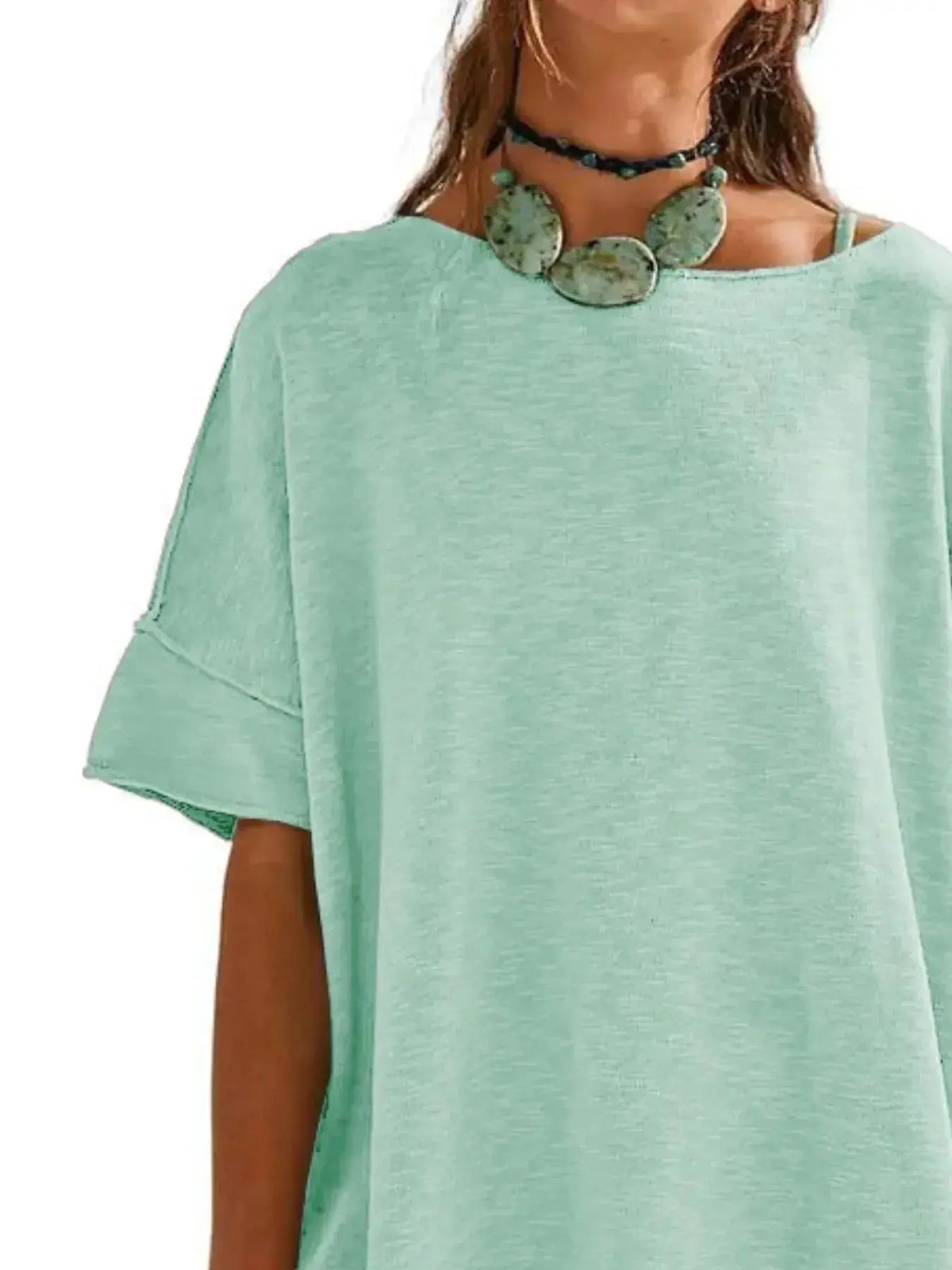 Women’s oversized drop-shoulder round neck casual T-shirt by Plush Fashion Hub, relaxed fit and soft fabric, worn casually.