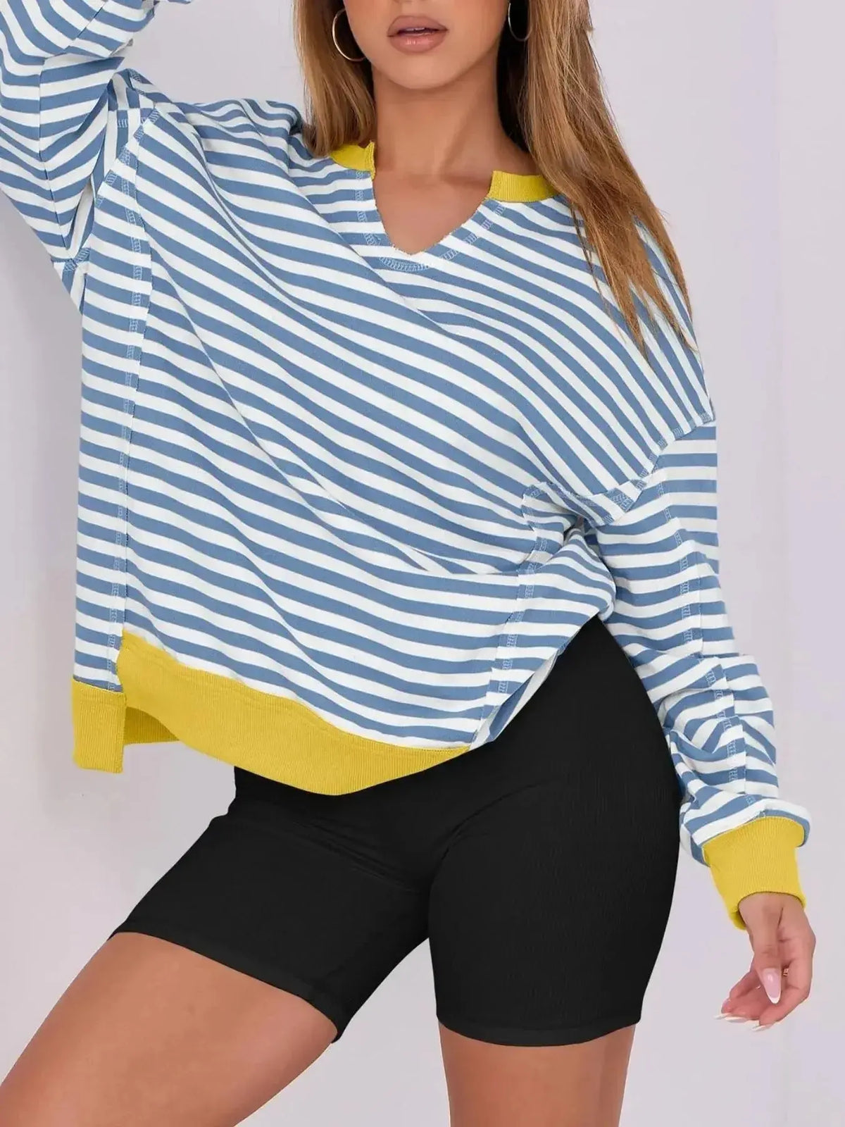 Women’s oversized notched neck sweatshirt with contrast stitching by Plush Fashion Hub, featuring a relaxed fit and stylish design.