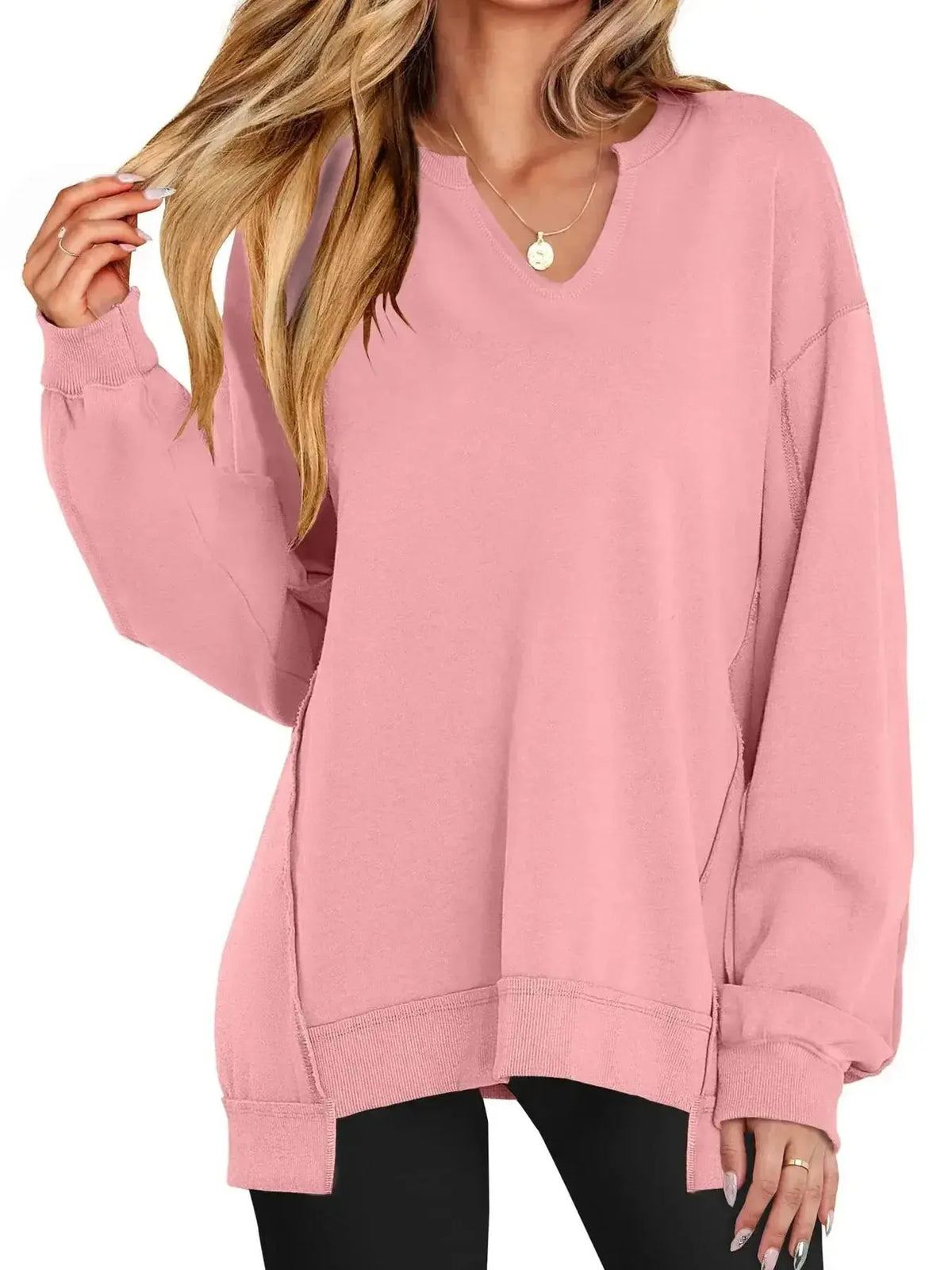 Women’s oversized sweatshirt with notched neckline and contrast stitching, stylish sweater from Plush Fashion Hub.