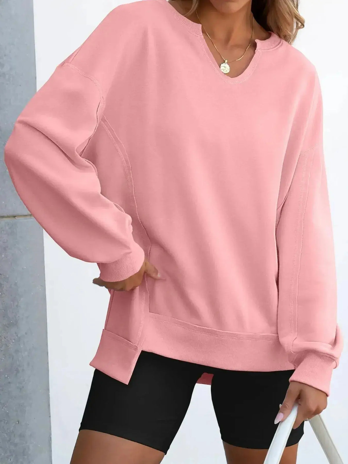 Women’s oversized notched neck sweatshirt with contrast stitching, stylish sweater by Plush Fashion Hub, featuring a relaxed fit and trendy design.