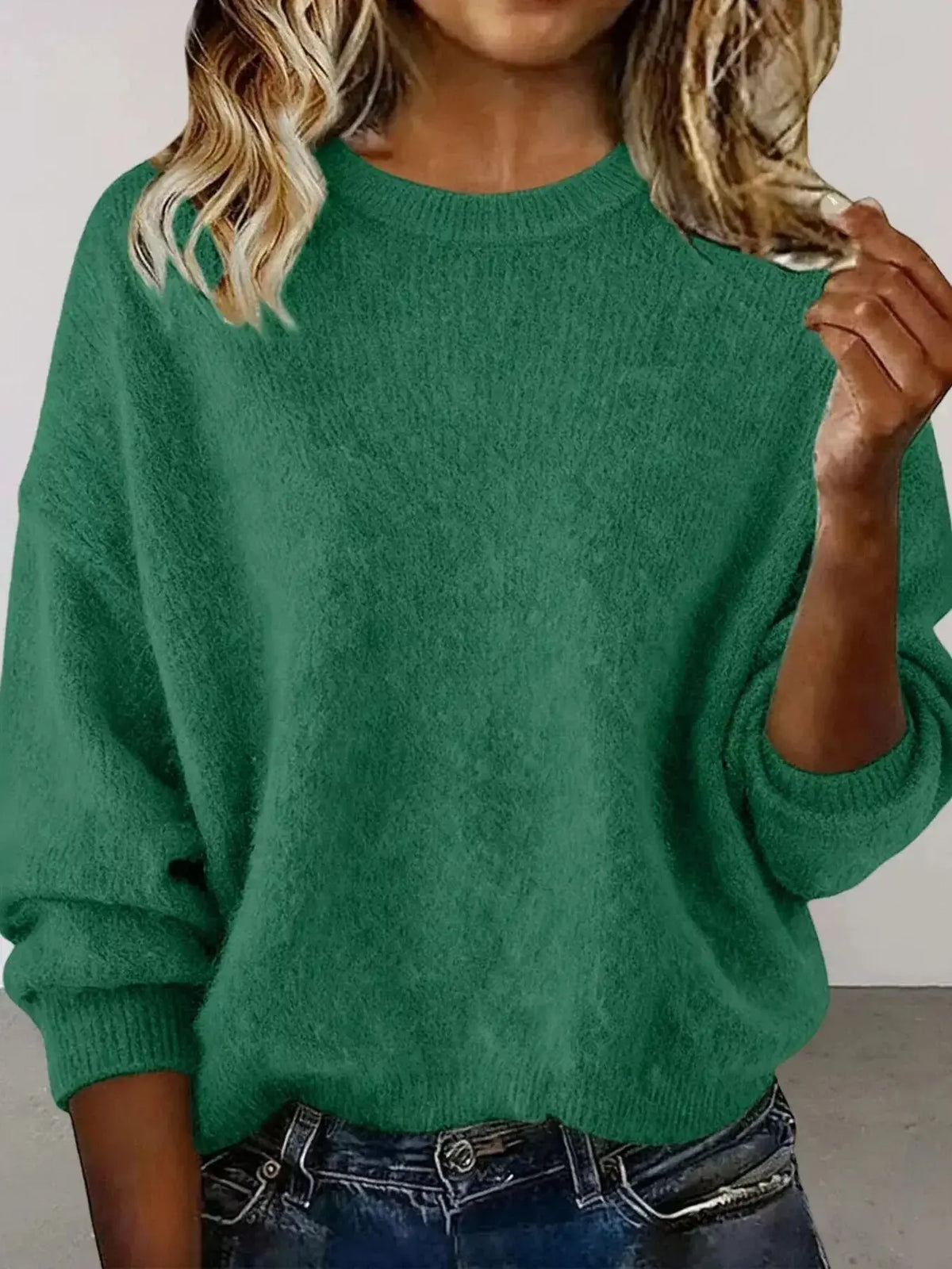 Plus size women's relaxed fit sweater with dropped shoulders and round neck in soft knit, from Plush Fashion Hub.