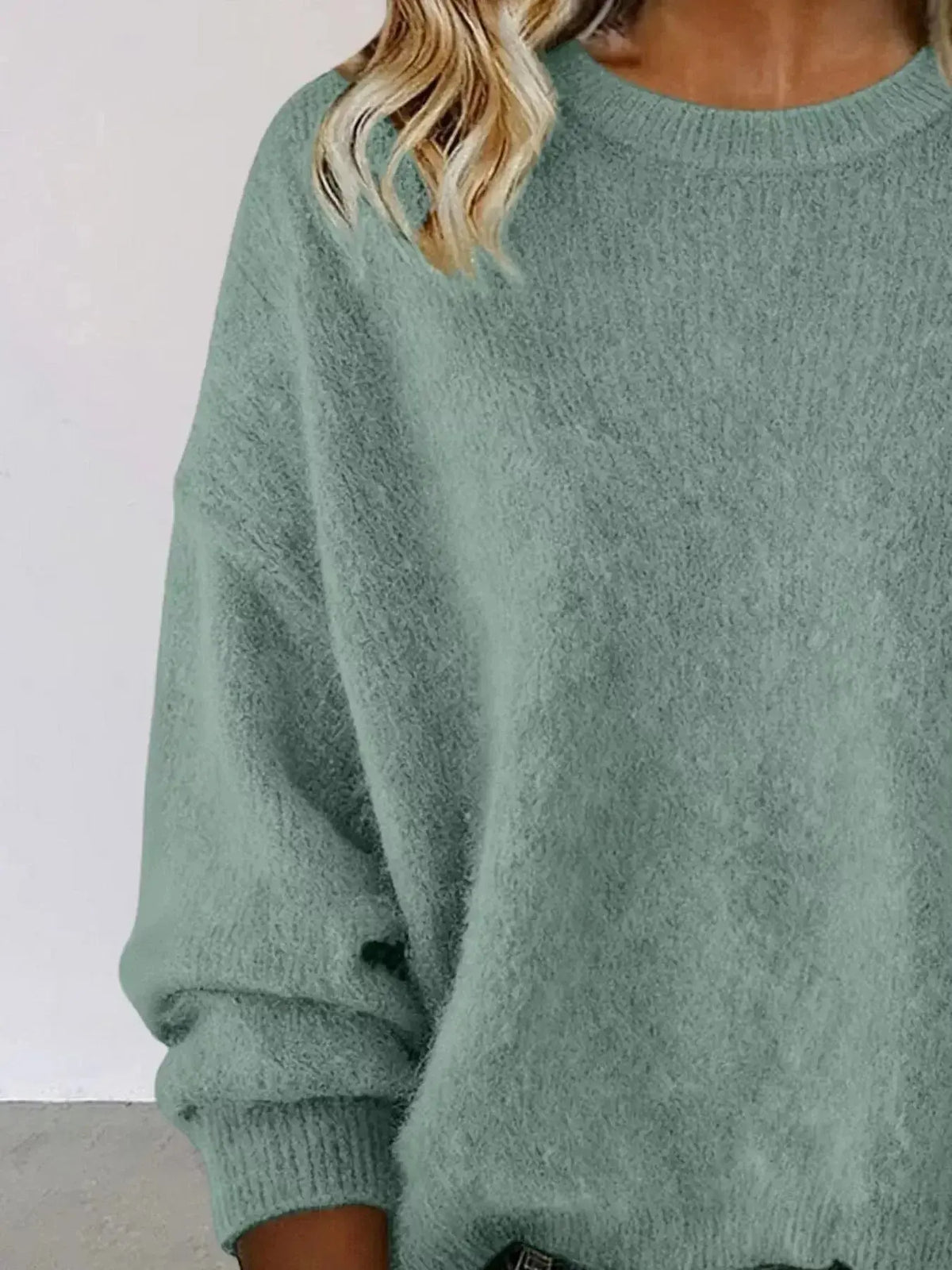 Plus size women's relaxed fit sweater with dropped shoulders and round neck, stylish sweater by Plush Fashion Hub.