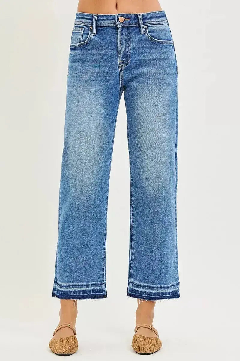 Plus size slouchy cropped boyfriend jeans by Plush Fashion Hub with distressed details and raw hem, showcasing a casual denim style.