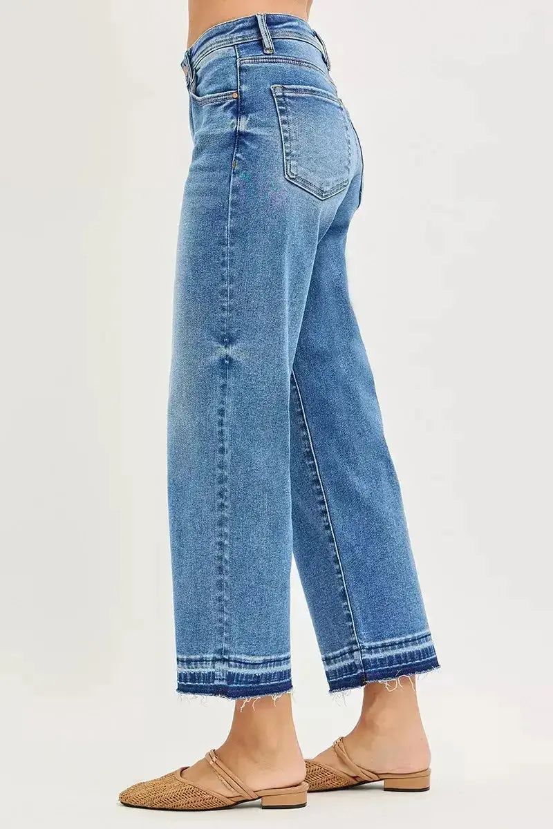 Plus size women's slouchy cropped boyfriend jeans by Plush Fashion Hub with distressed details and raw hem denim.