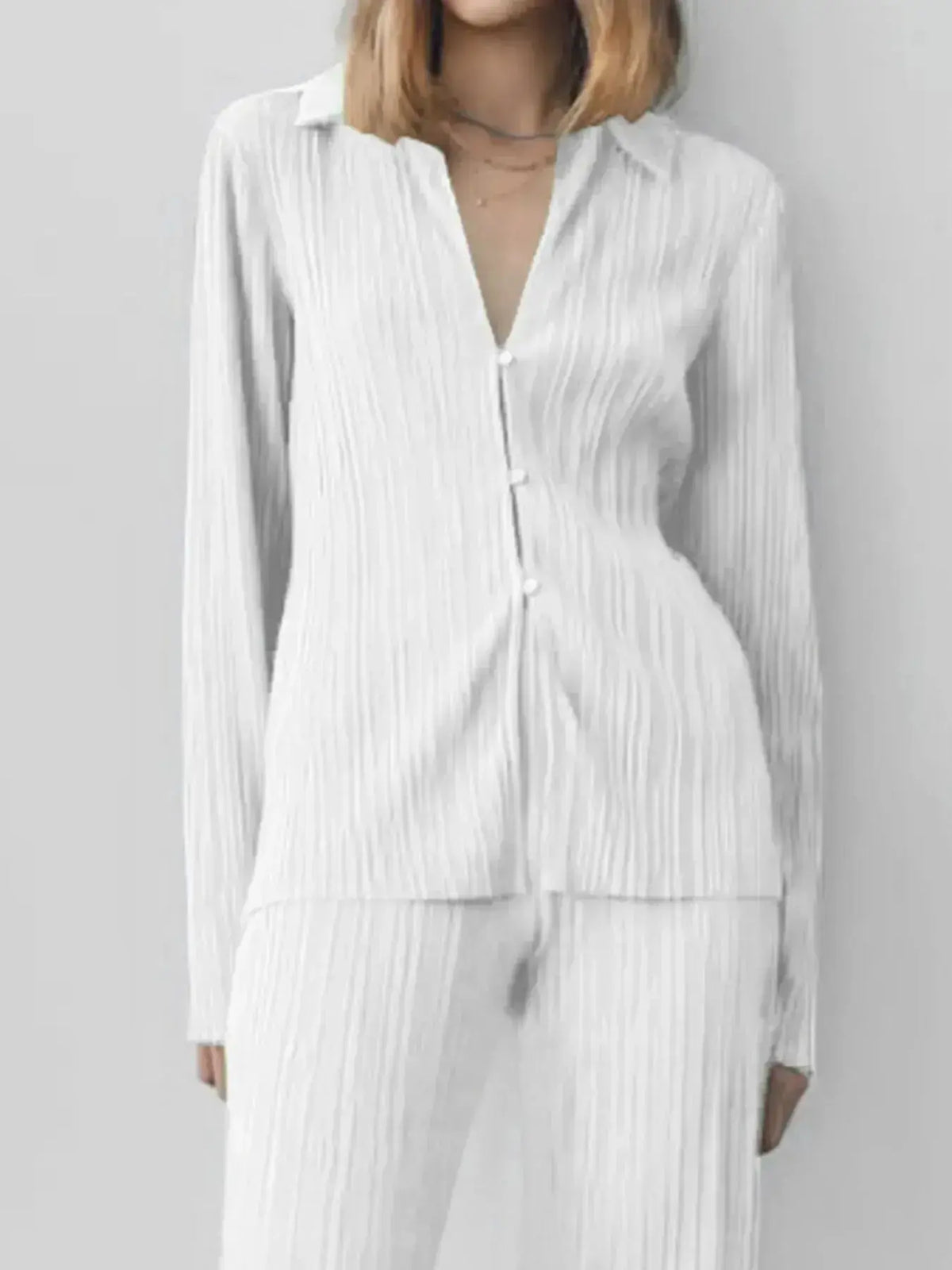 Women's textured long sleeve button-up lounge set pajamas from Plush Fashion Hub, cozy two-piece sleepwear with a relaxed fit.