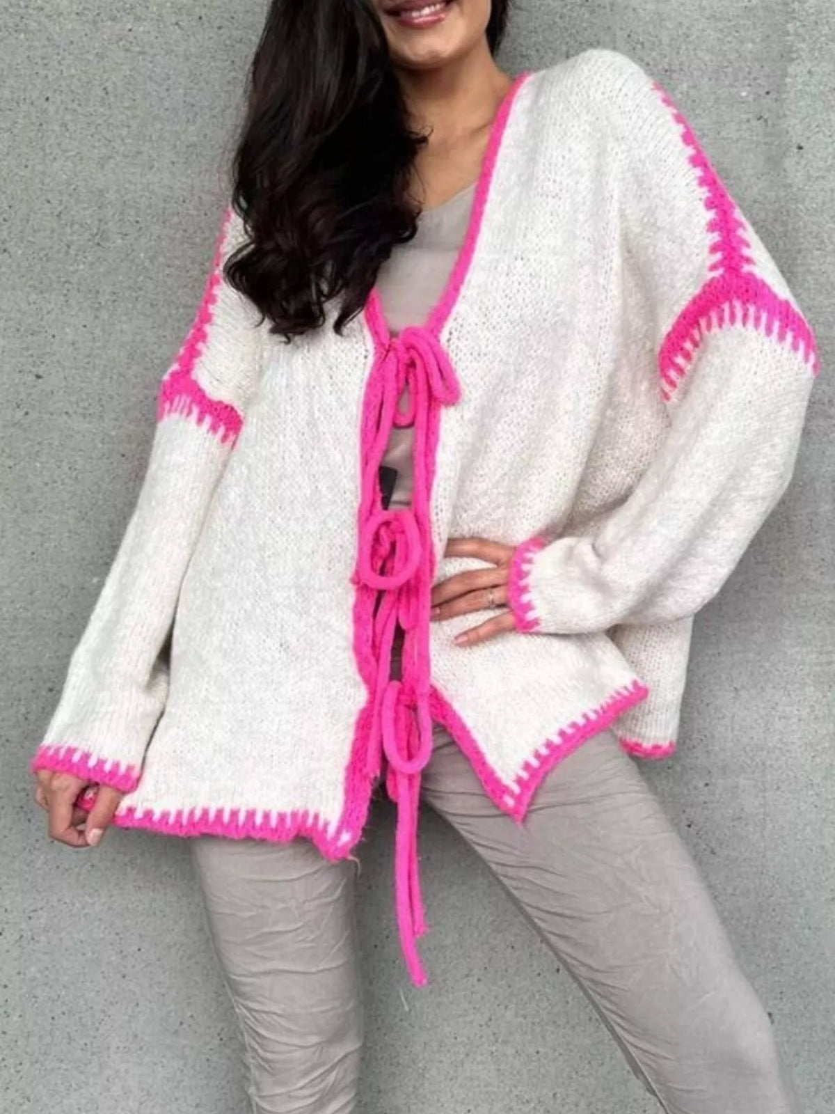 Light beige tie front drop shoulder cardigan by Trendsi, featuring a relaxed fit and soft knit fabric with long sleeves.