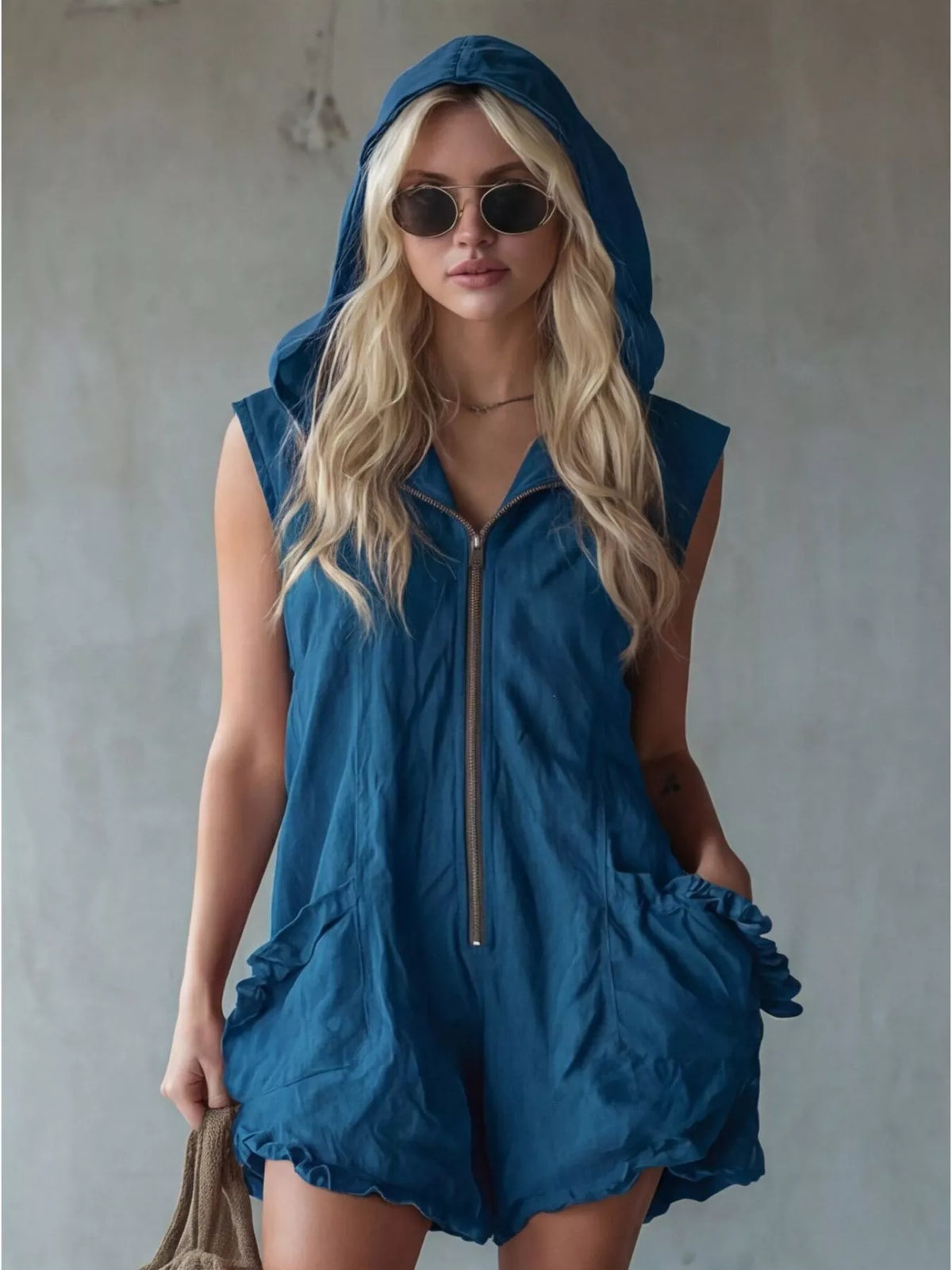 Plus size hooded sleeveless zipper romper with ruffled pockets, featuring a full-length design and casual style from Plush Fashion Hub.