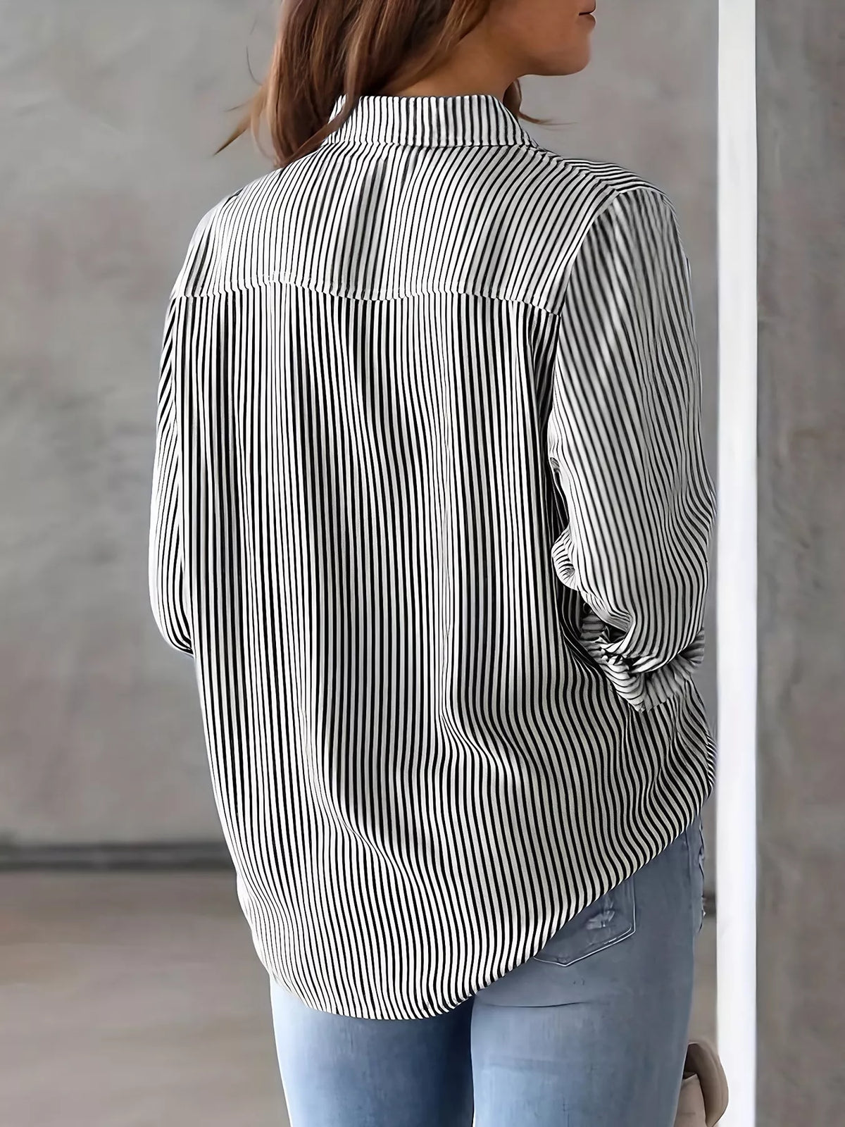 Women’s classic striped button-down shirt by Trendsi, featuring a stylish pattern and collar, displayed on a white background.