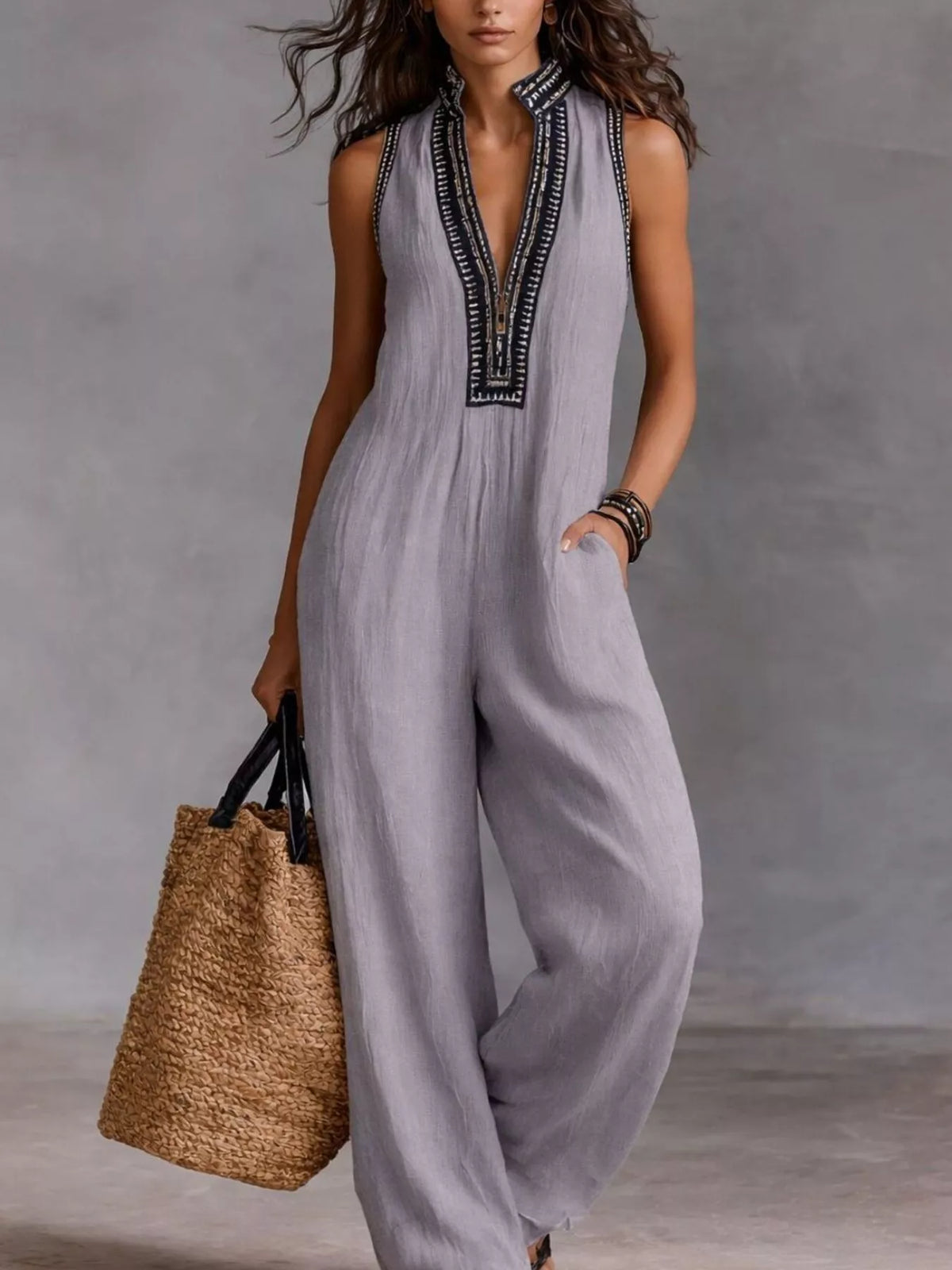 Plus size full length sleeveless wide leg jumpsuit by Trendsi, featuring a flattering fit and flowing fabric.