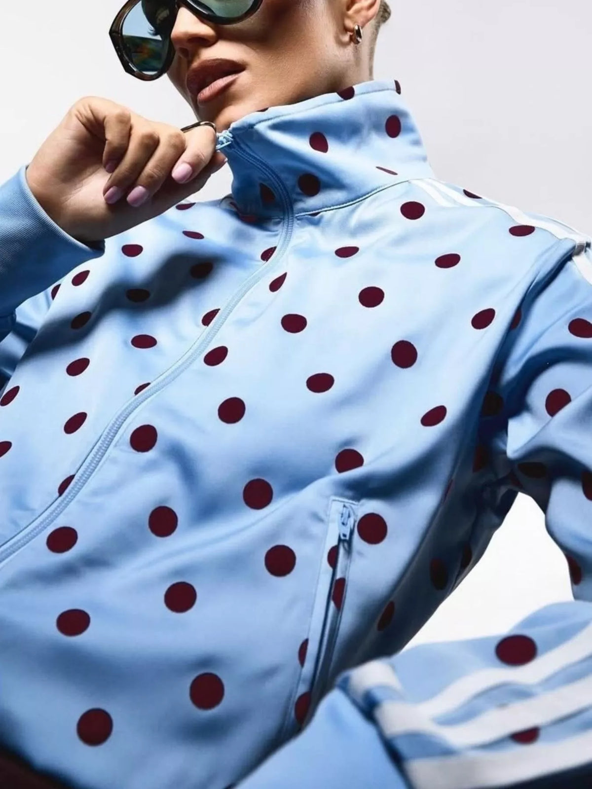 Polka dot zip-up outerwear and pants set by Plush Fashion Hub, featuring a stylish matching outfit with a zip-up jacket and matching pants.