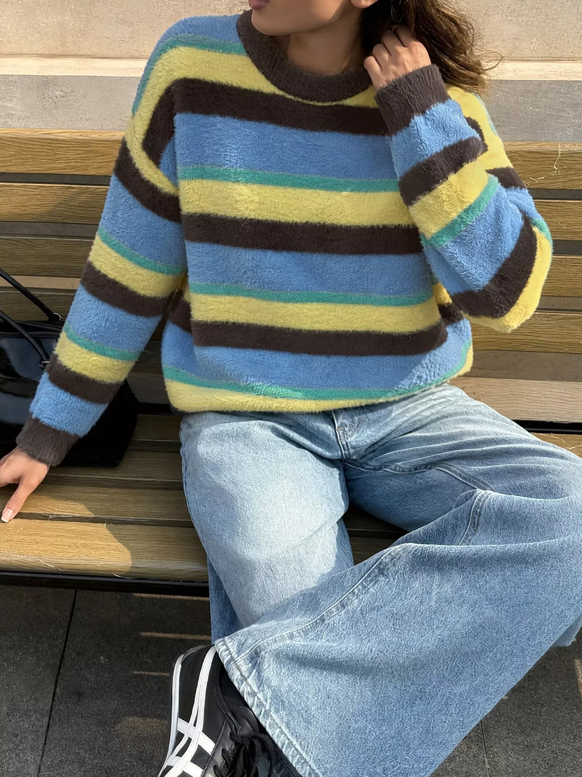 Striped dropped shoulder sweater by Trendsi featuring a relaxed fit and bold horizontal stripes, displayed on a mannequin.