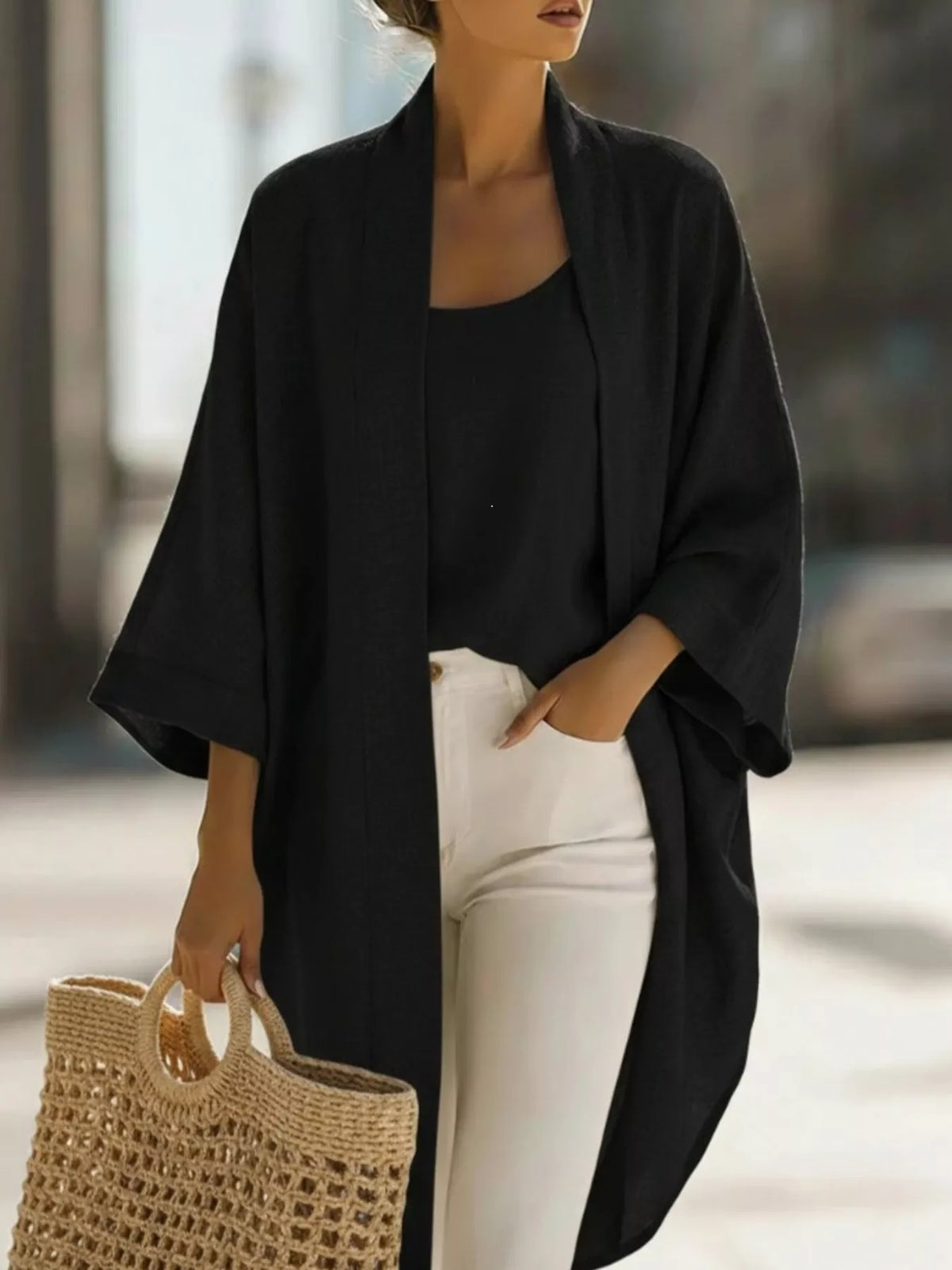 Plus size open-front cardigan and matching tank top set by Trendsi, shown on a model with a casual, stylish look.