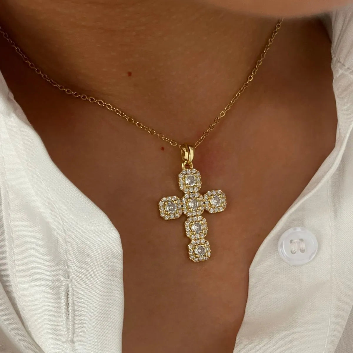 Stainless steel inlaid zircon cross necklace with detailed design, showcasing a stylish and elegant jewelry piece.