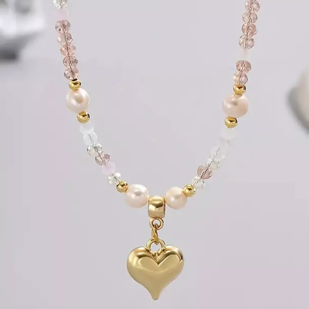 Bead heart pendant necklace by Plush Fashion Hub featuring a delicate heart-shaped beaded charm on a silver chain.