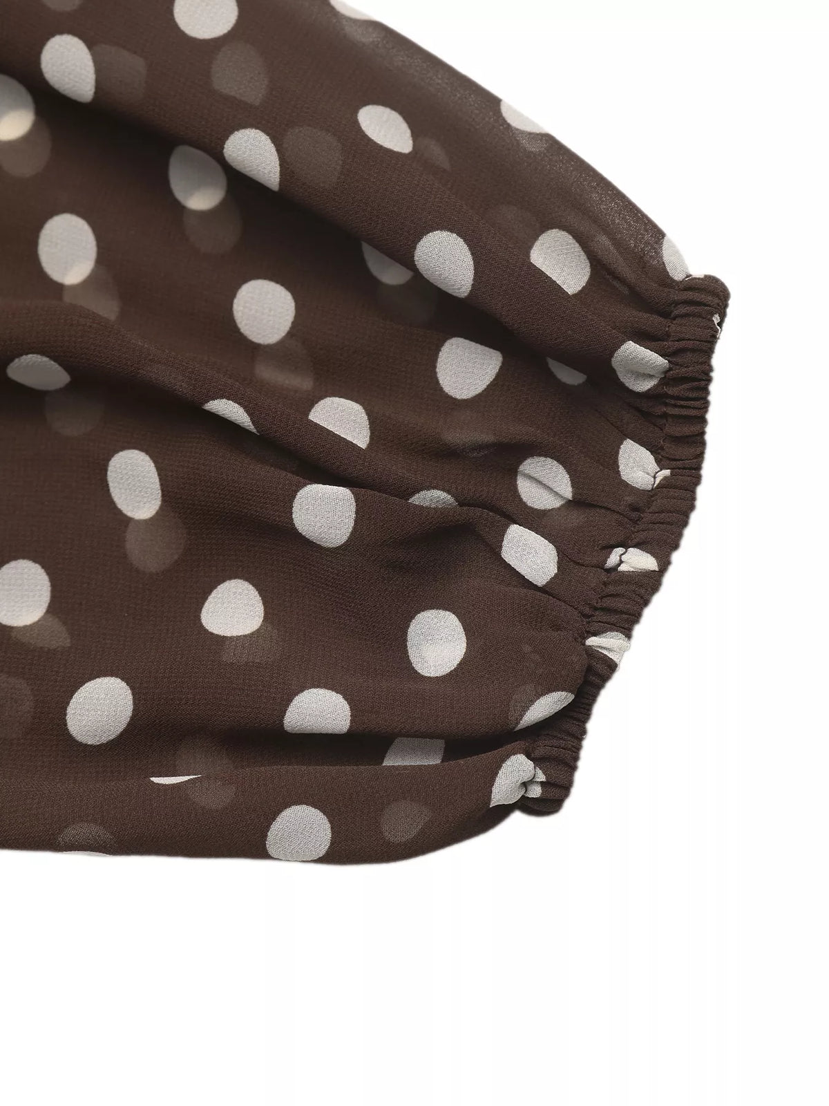 Polka dot mock neck long sleeve blouse from Trendsi, featuring a stylish design with a fitted fit and classic pattern.