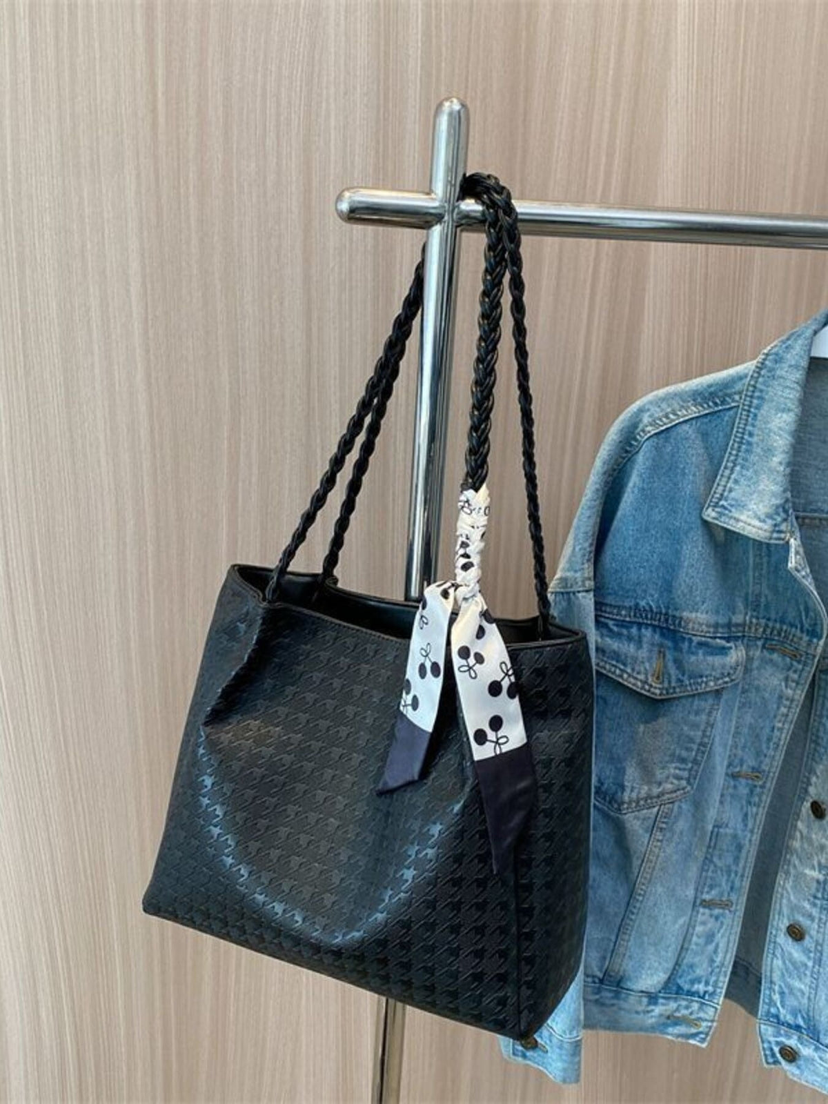 Plush Fashion Hub braided handle tote bag with woven design, large open main compartment, and sturdy handles for everyday use.