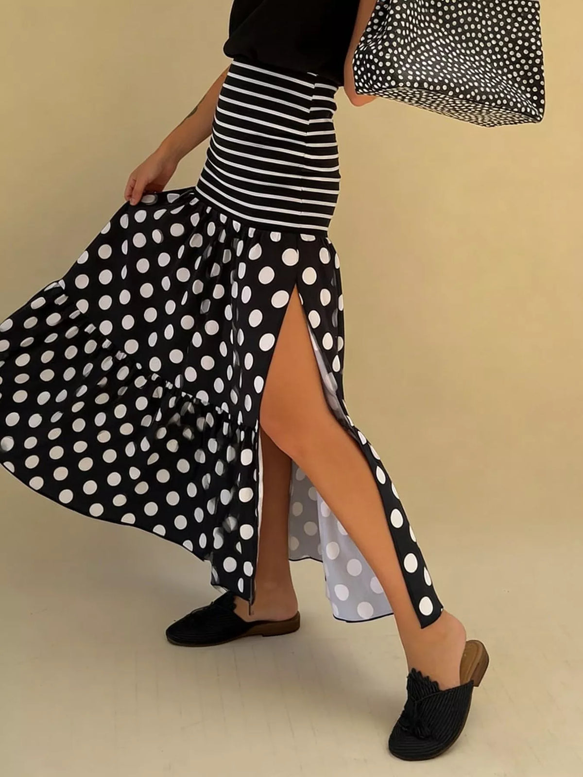 Flowy women’s polka dot and striped maxi skirt with a slit, casual bohemian style from Plush Fashion Hub.