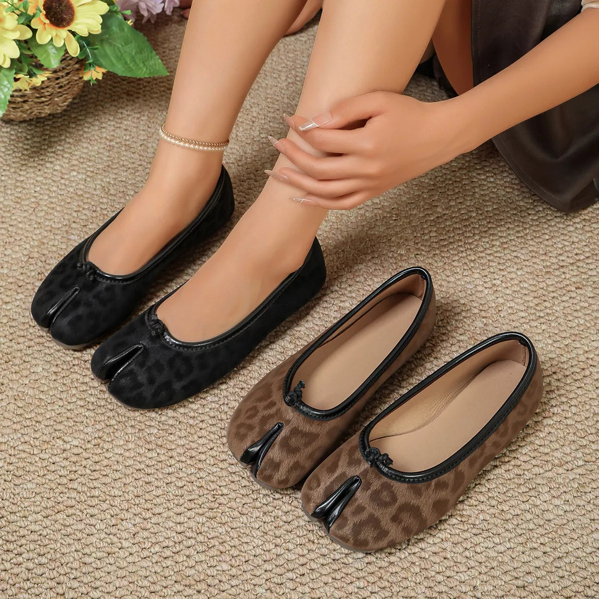 Split-toe leopard slip-on shoes by Trendsi with bold animal print, casual slip-on style, and comfortable design.