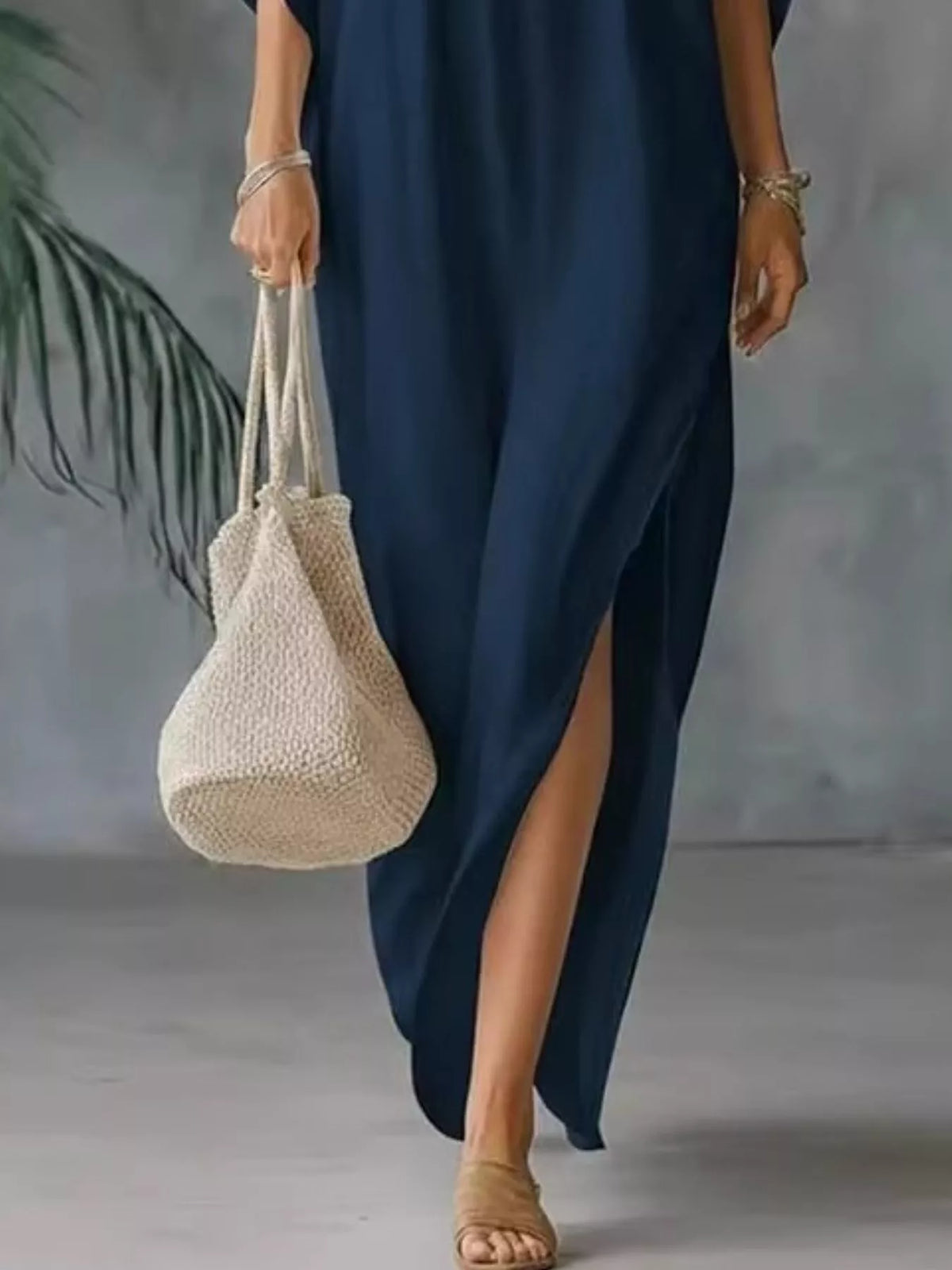 Plush Fashion Hub plus size V-neck maxi dress with side slits, soft fabric, full length, in a flowing design.