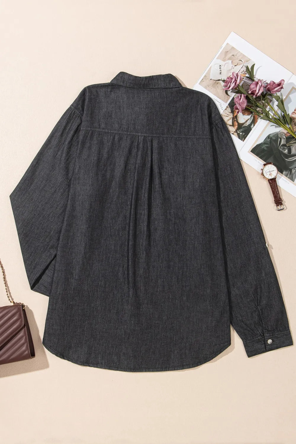 Denim top with long sleeves, collared neck, and pockets, styled as denim jeans from Trendsi, shown in the image.