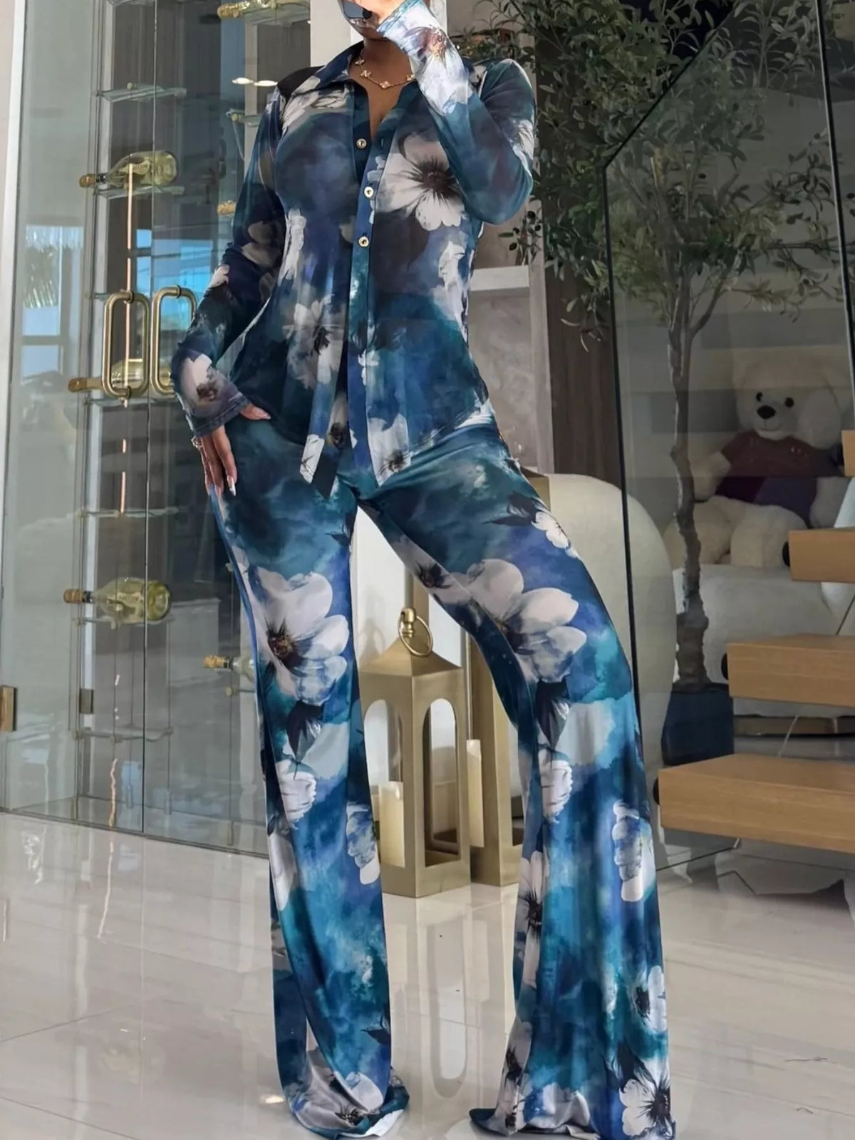 Printed mesh shirt and pants set for women by Trendsi, featuring lightweight, breathable fabric with colorful pattern details.