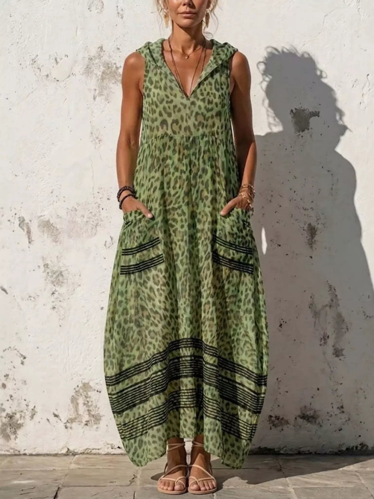 Plus size leopard print sleeveless hooded maxi dress with pockets, stylish and comfortable by Trendsi.
