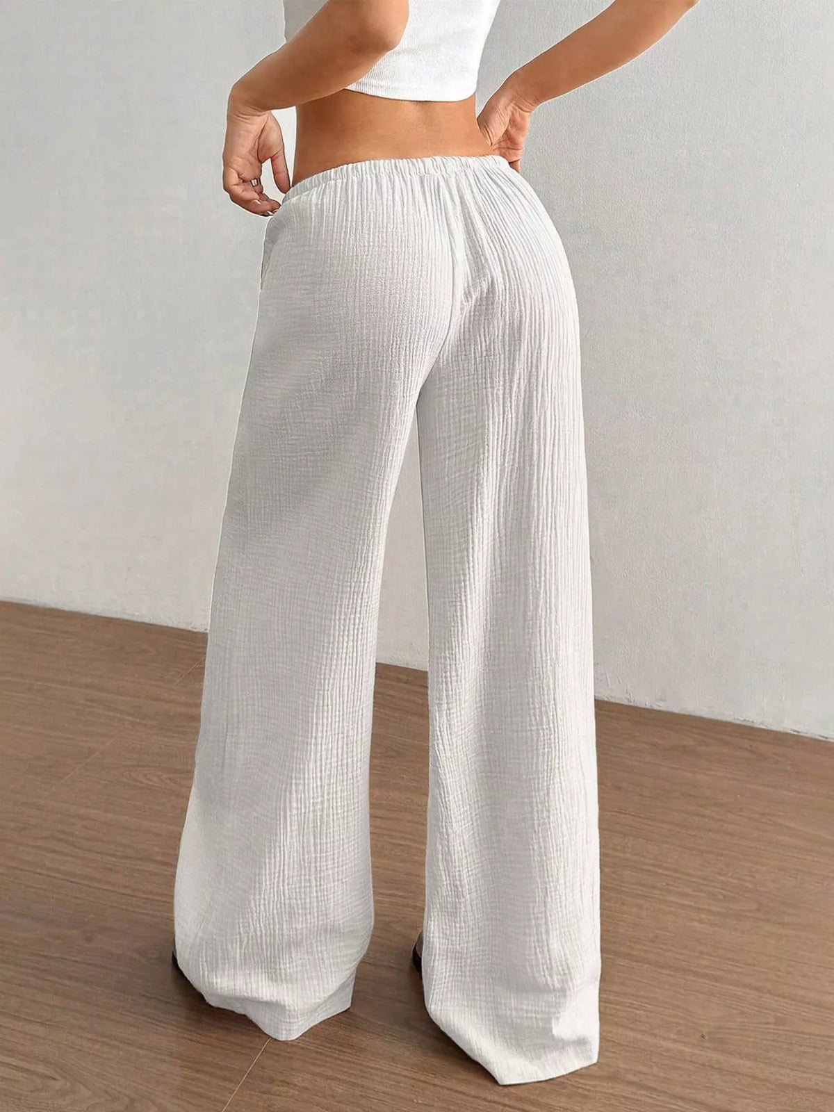 Plush Fashion Hub wide-leg drawstring pants in soft fabric, featuring a relaxed fit and casual style, shown on a model.