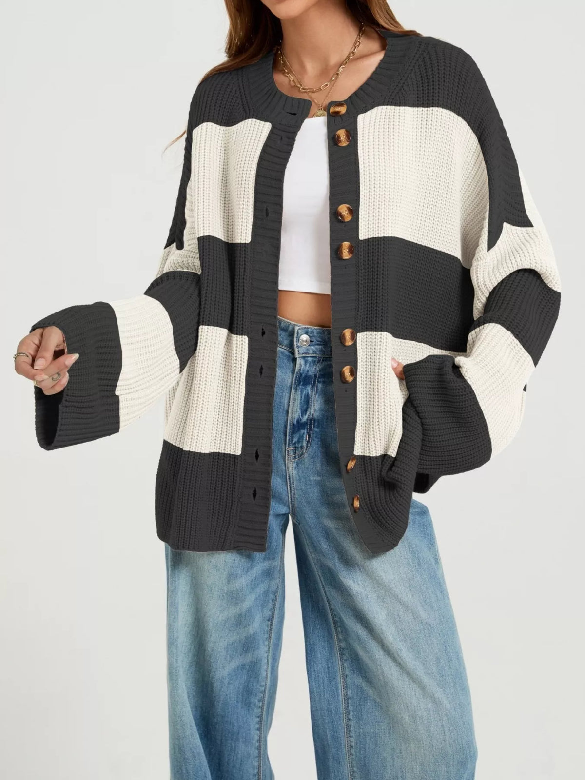 Color block striped button-up cardigan by Trendsi, featuring vibrant color blocks and a classic button-up design.