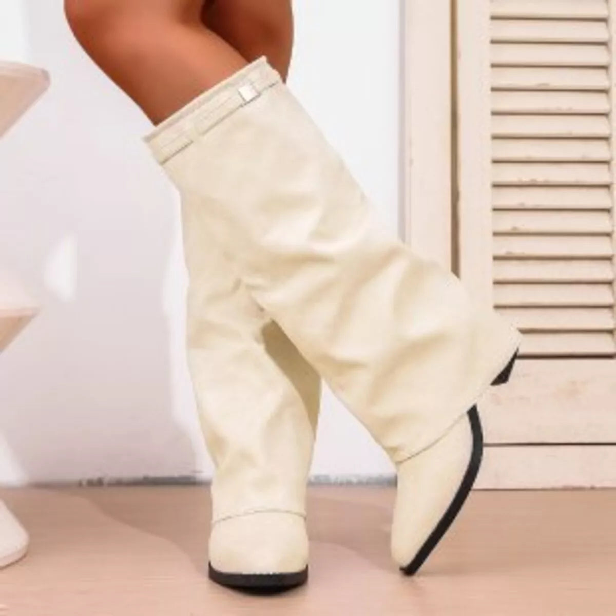 Point toe block heel boots from Trendsi, stylish footwear featuring a sleek design with a comfortable chunky heel.