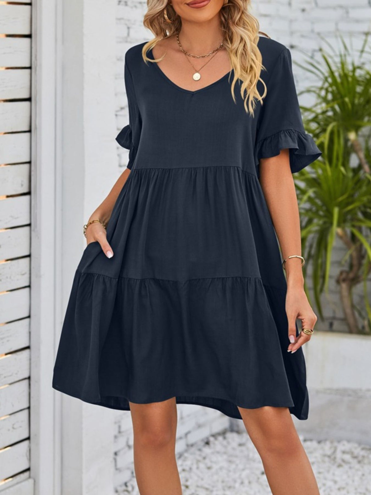 Lightweight rayon mini dress by Plush Fashion Hub with ruffled sleeves, tiered design, and side pockets.