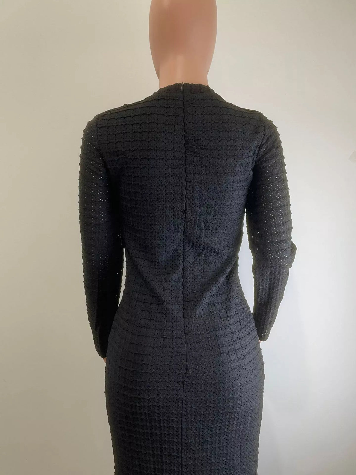 Plush Fashion Hub textured midi dress featuring decor button details, showcasing a stylish and comfortable dress design.