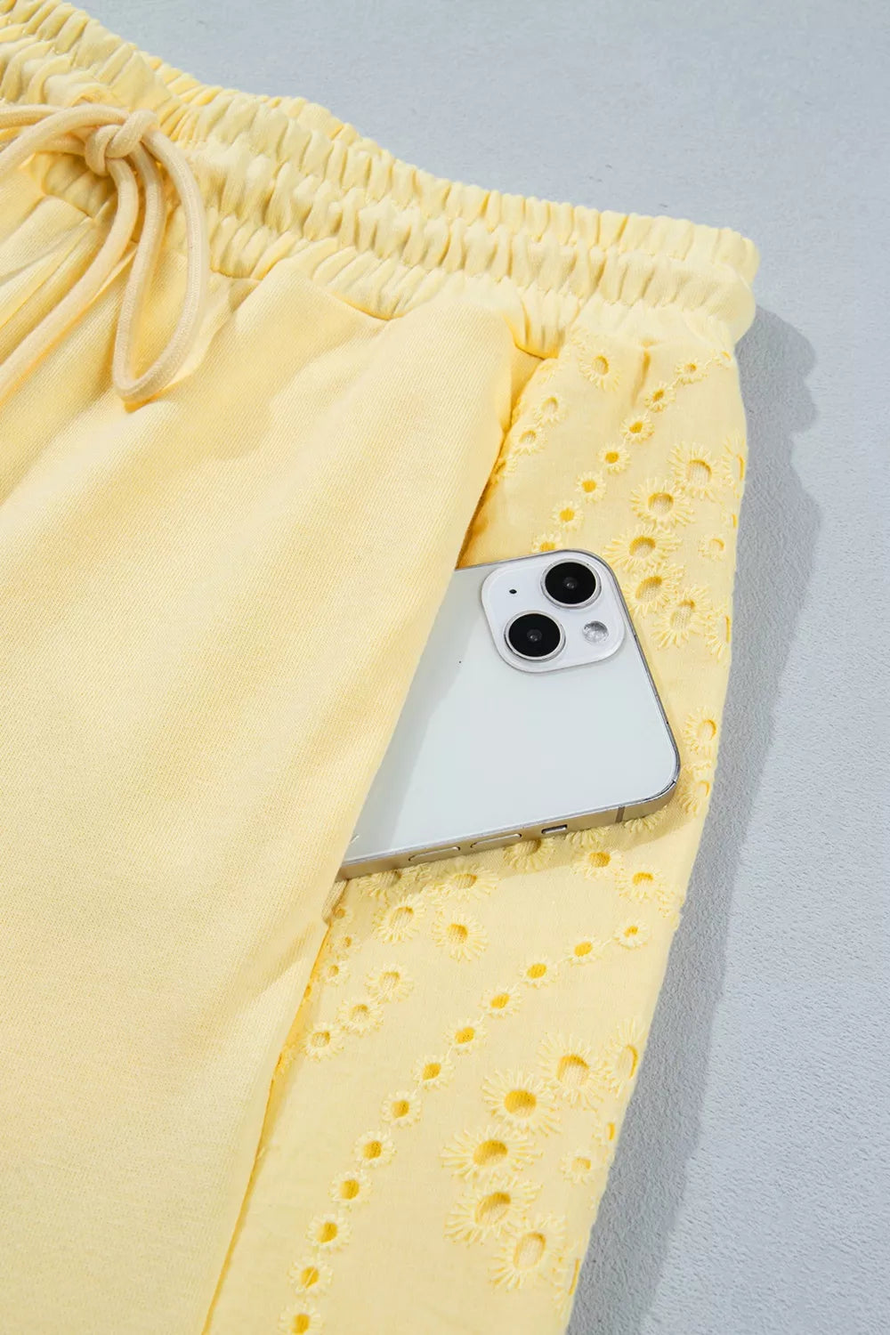 Plush Fashion Hub plush rings set featuring a half-sleeve top and drawstring pants with soft, colorful ring patterns.