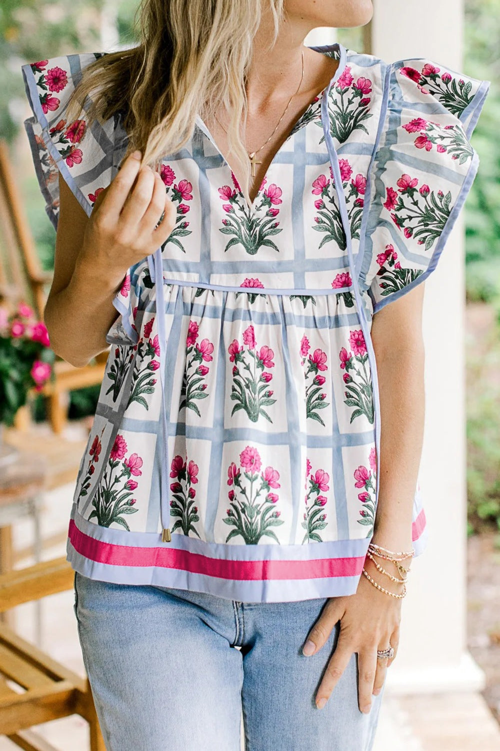 Women’s floral print blouse by Plush Fashion Hub with ruffle sleeves and tied neckline, lightweight and stylish for casual wear.