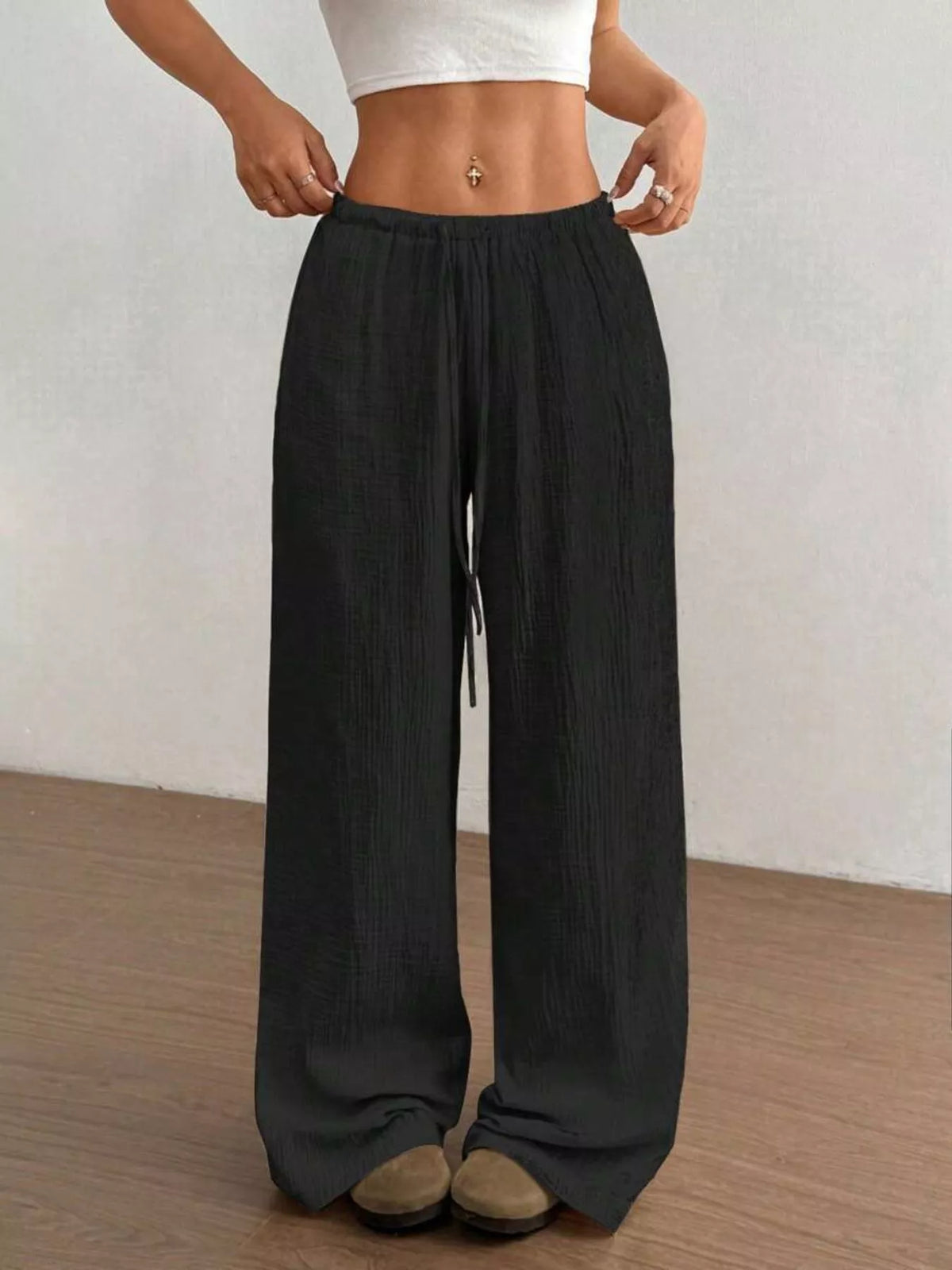 Plush Fashion Hub wide-leg drawstring pants made of plush fabric, featuring a relaxed fit and comfortable waistband.