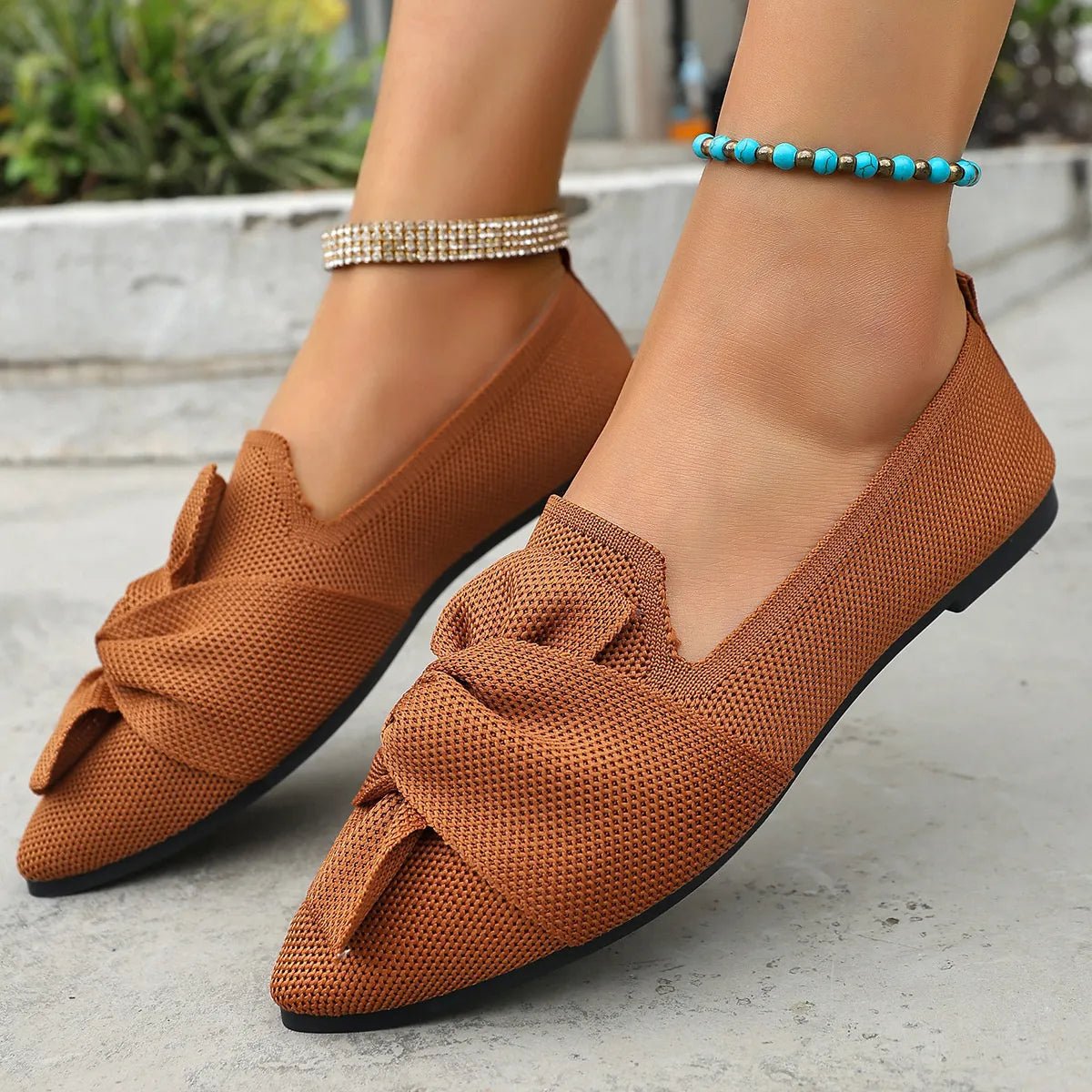 Elegant Plush Fashion Hub bow embellished pointed toe flat slip-on shoes with sleek design and comfortable fit.