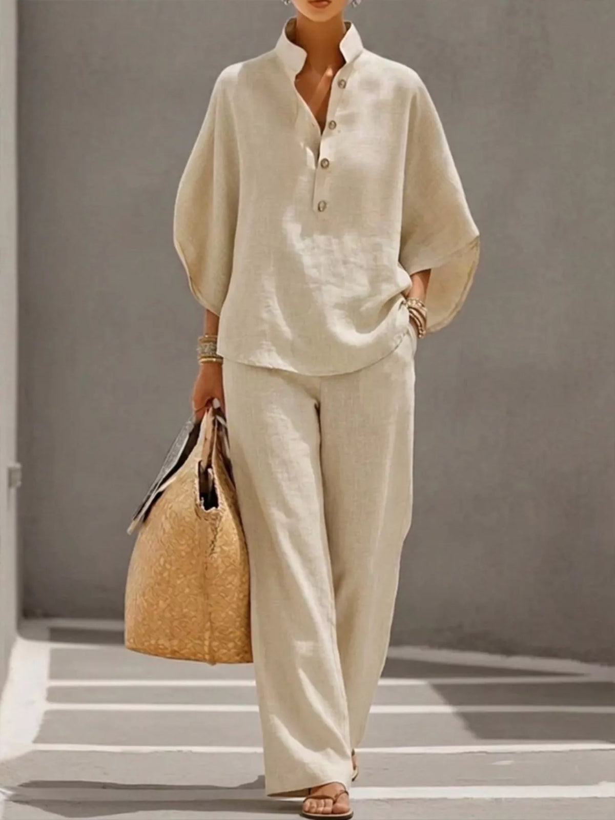 Plus size women's two-piece set with button details and 3/4 sleeves, featuring a top and pants from Plush Fashion Hub.