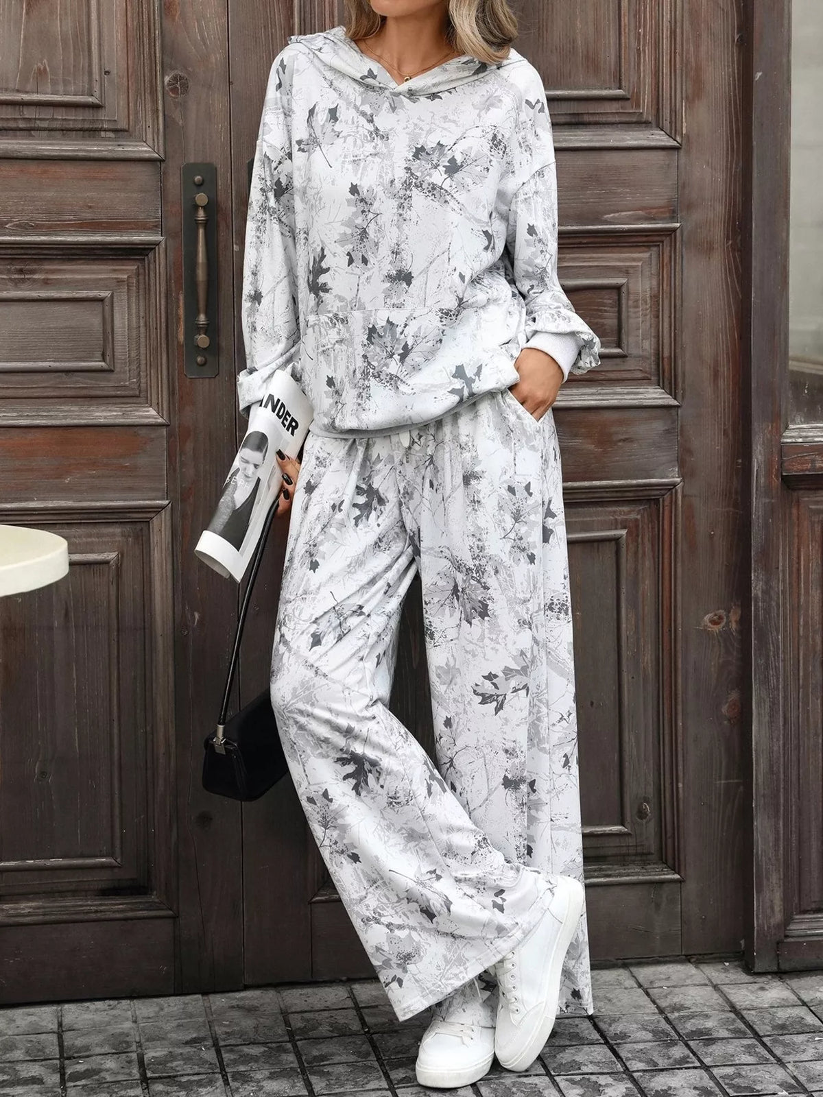 Printed long sleeve hoodie and pants set by Trendsi, featuring a comfortable matching casual loungewear outfit.
