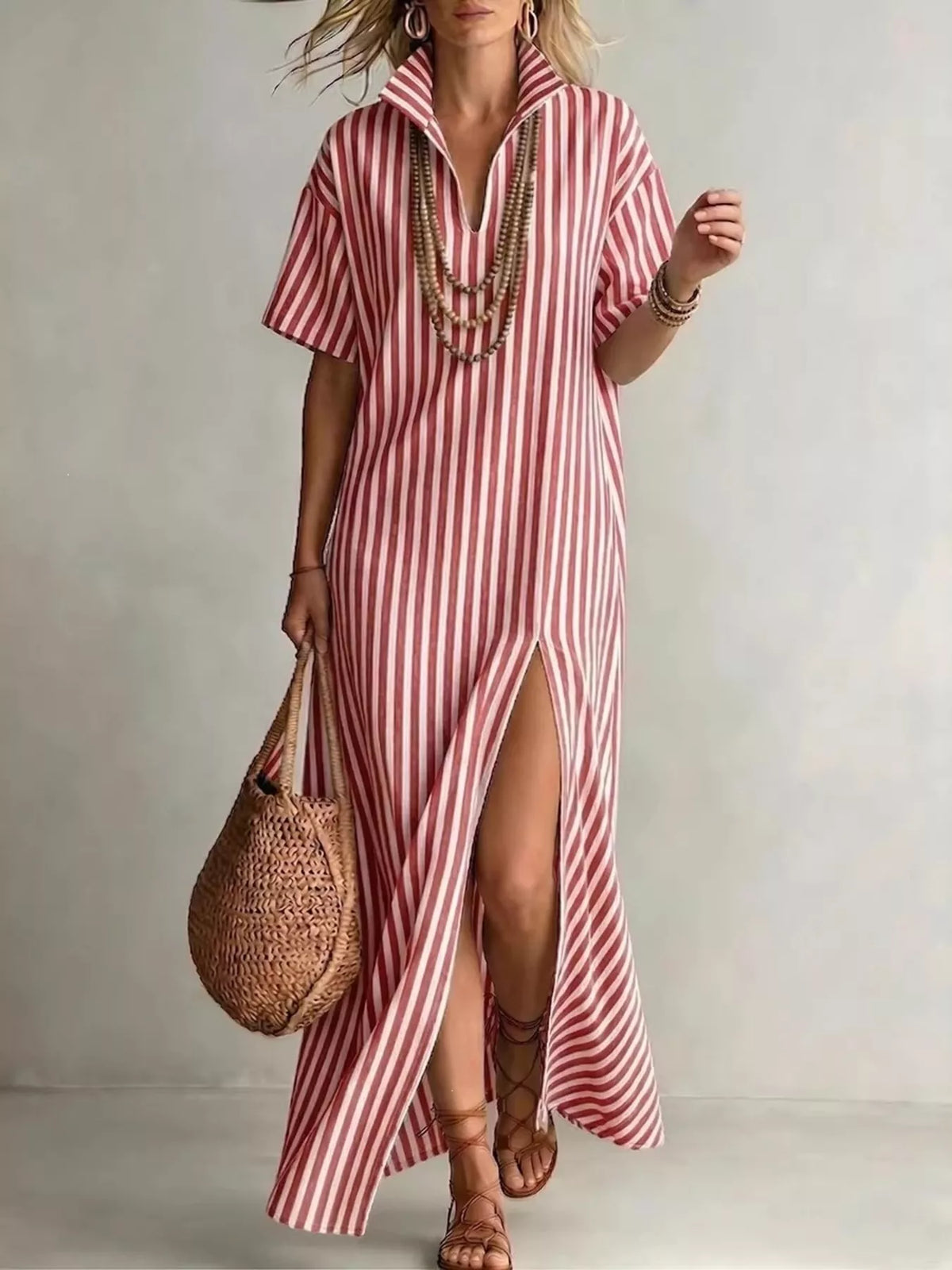 Plus size striped maxi dress with side slit by Trendsi, showcasing a flowing, full-length dress designed for curvy figures.