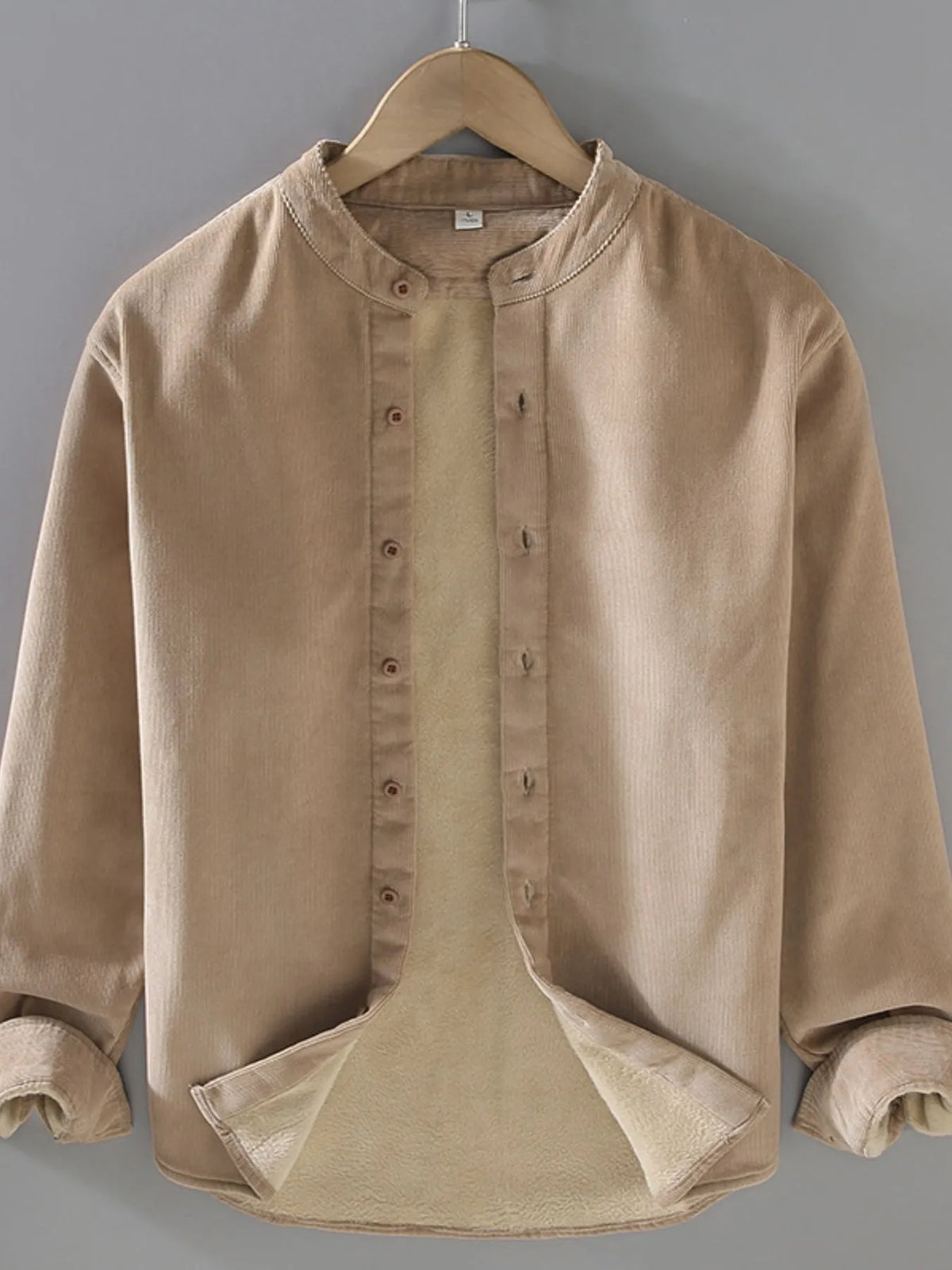 Men's plus size button-up long sleeve jacket from Trendsi, shown in dark fabric with collar and front button closure.