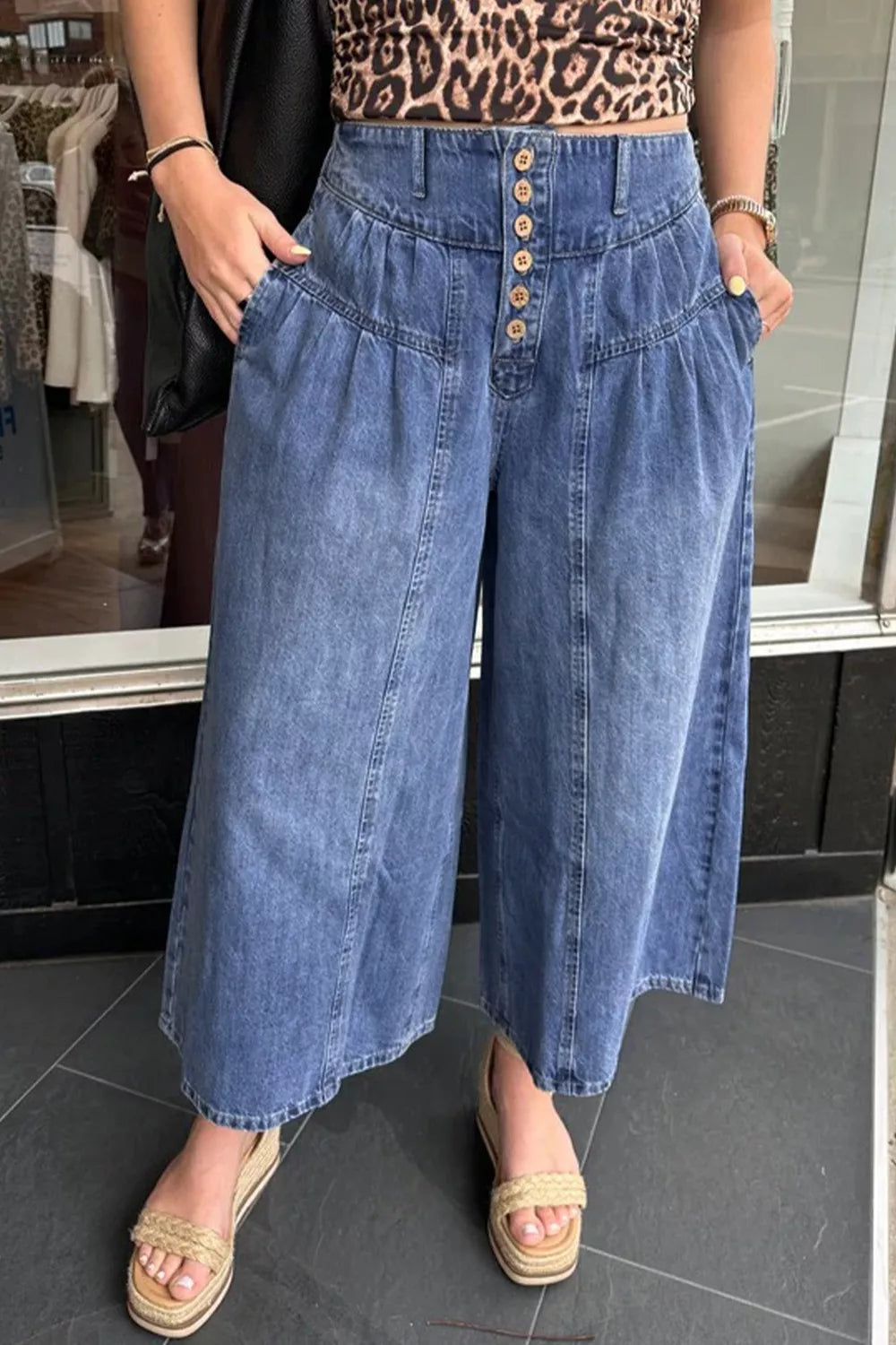 Light blue high-waisted cotton denim jeans with wide legs and button-fly closure from Plush Fashion Hub.