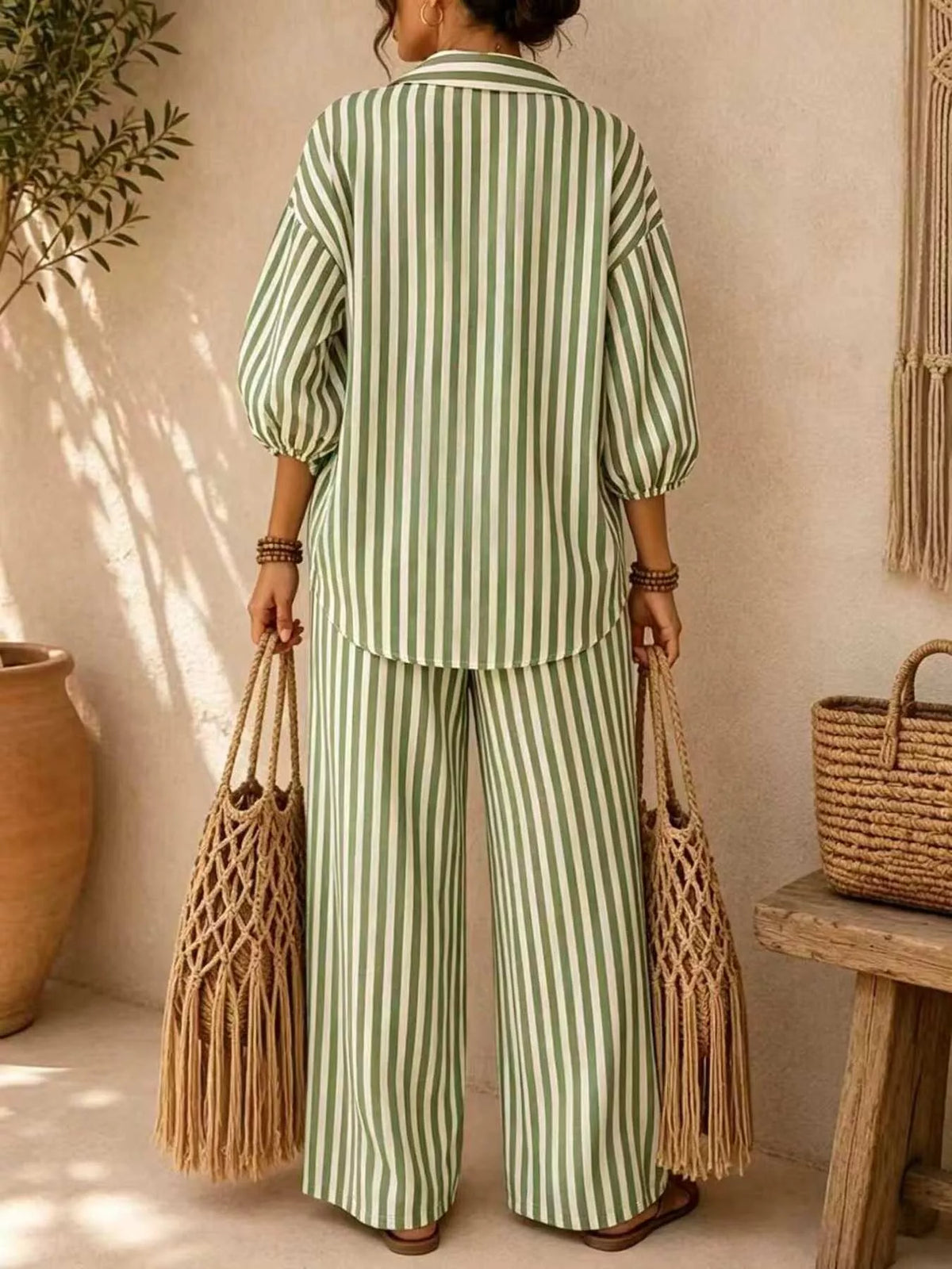 Plus size striped puff sleeve shirt and wide-leg drawstring pants matching set by Trendsi, styled with a relaxed fit and vibrant pattern.