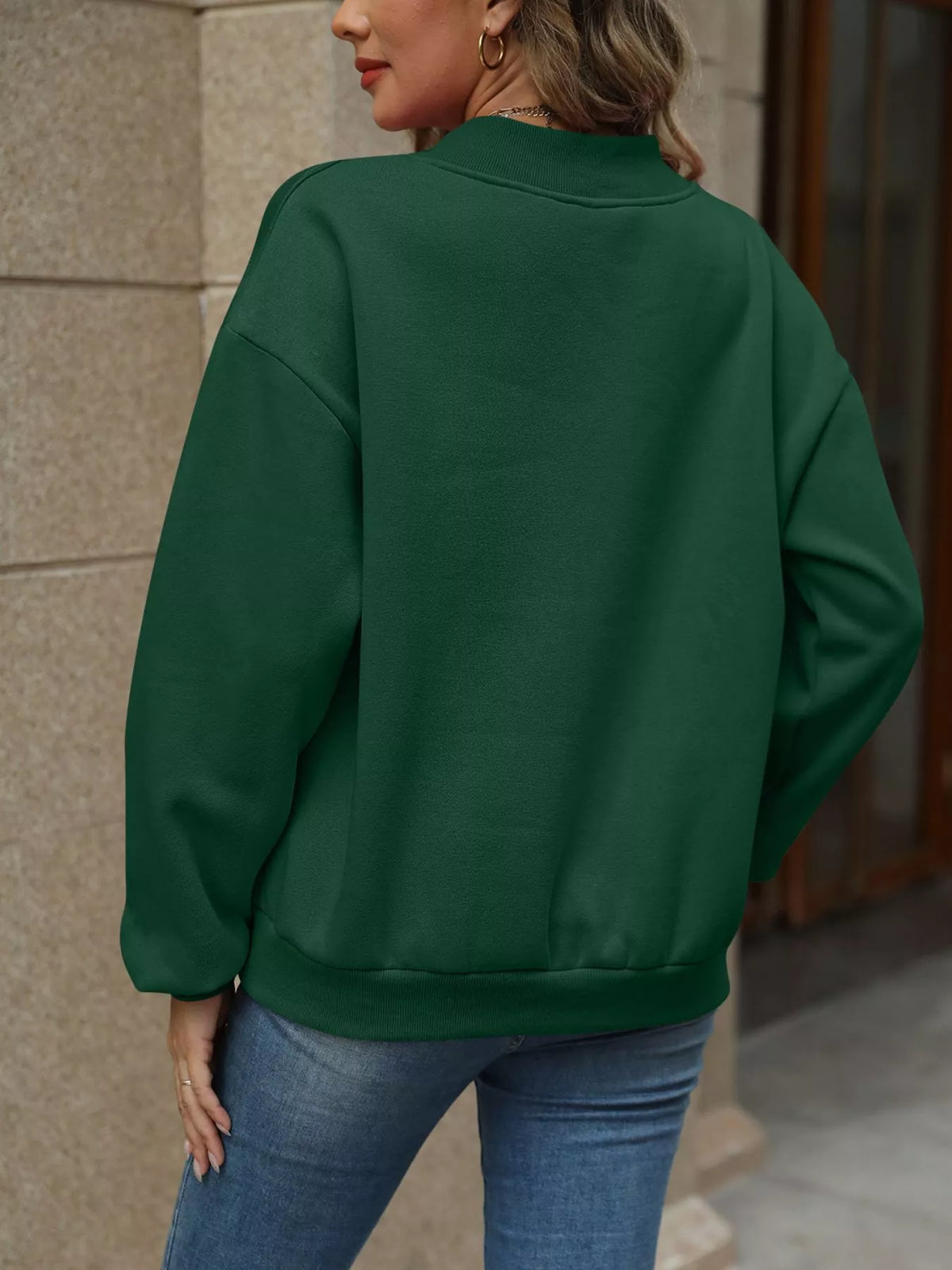 V-neck solid color casual sweatshirt by Trendsi, showing front view with long sleeves and relaxed fit in soft fabric.