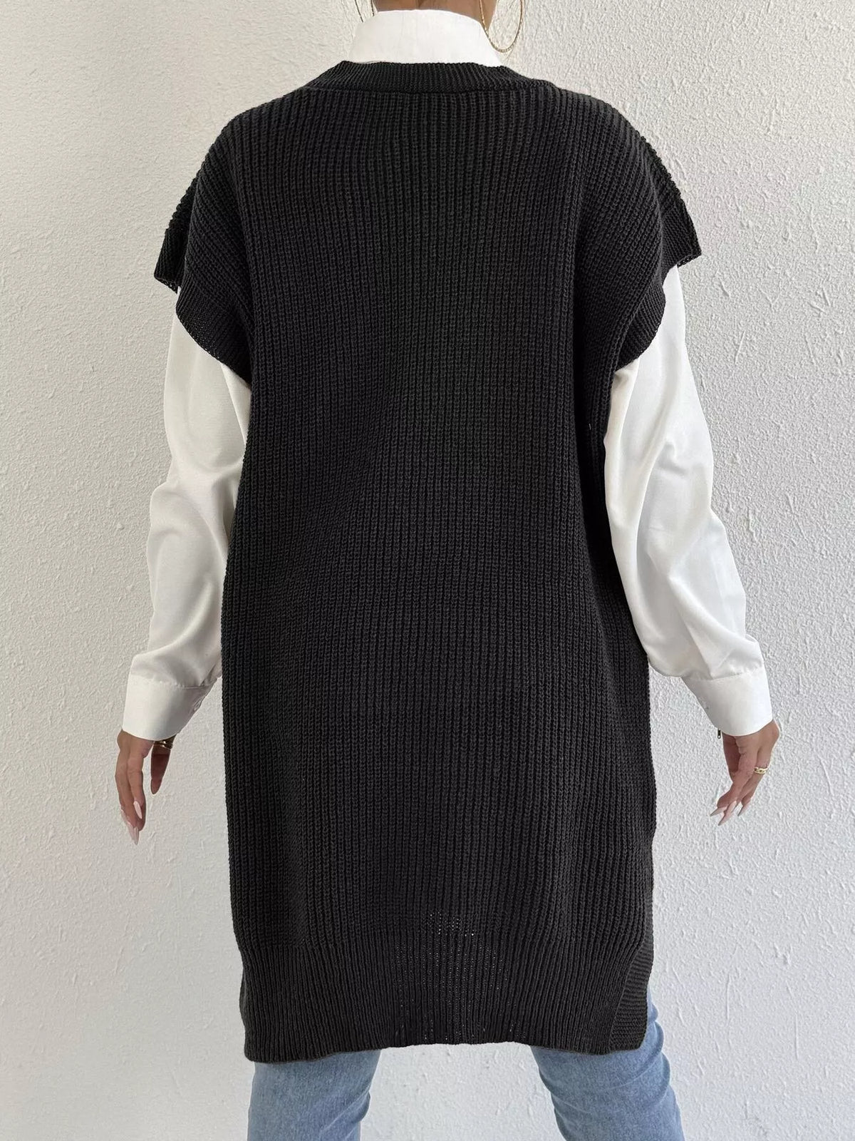 Embroidered bow V-neck sweater vest by Trendsi featuring a stylish design and soft knit fabric, displayed on a model.