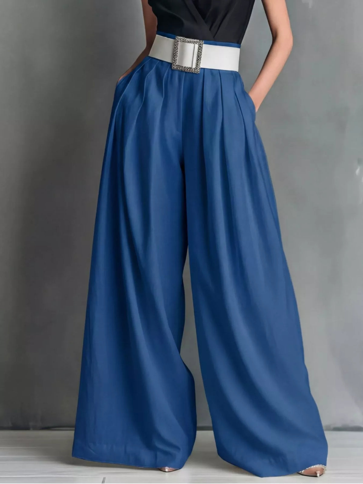 High-waisted wide-leg pants by Plush Fashion Hub, shown in a stylish and flowing fit with a smooth fabric texture.
