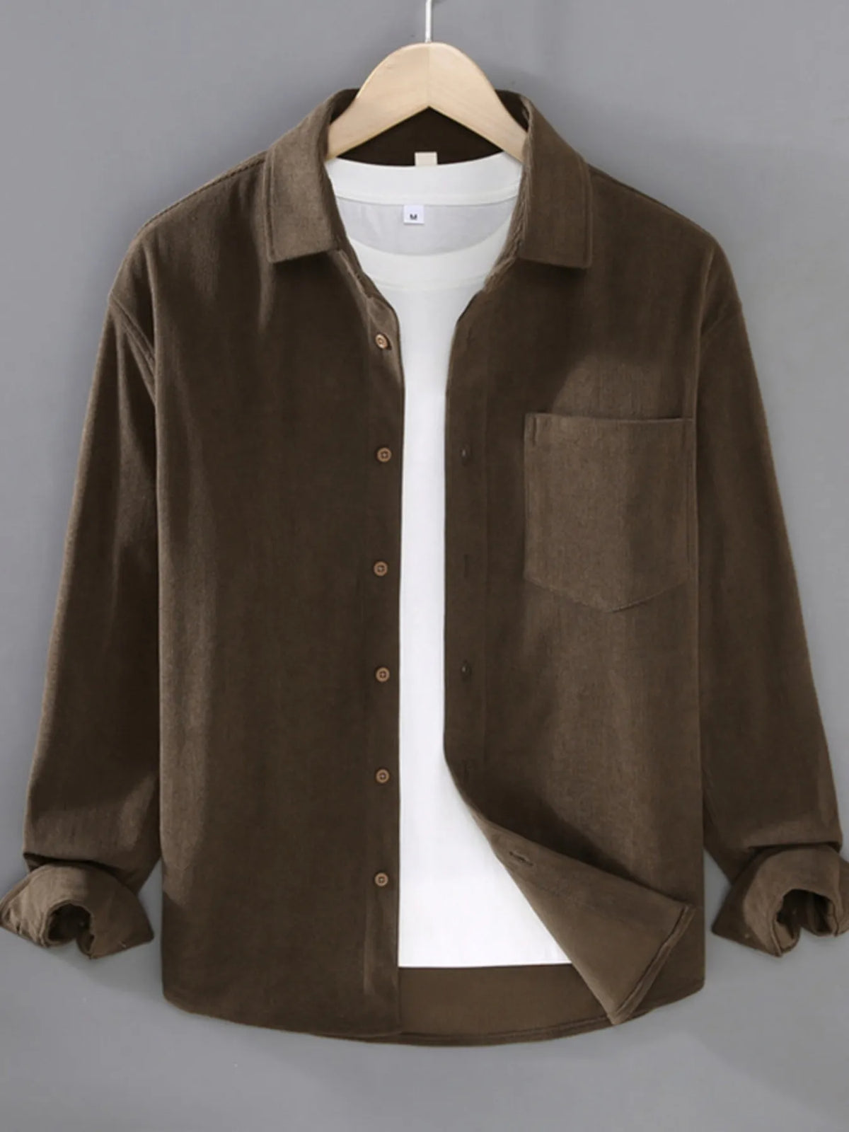 Plus size men's long sleeve button-up shirt by Trendsi, shown in a classic design with collar and chest pocket.