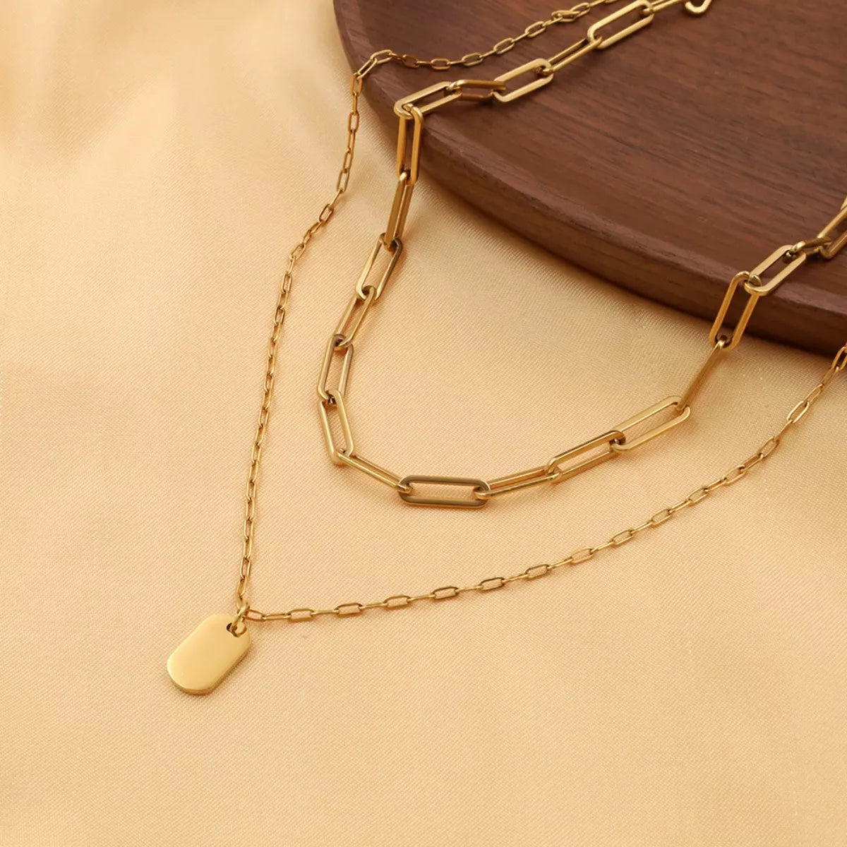 Gold-plated double layered necklace from Plush Fashion Hub with intricate chain design and elegant style.