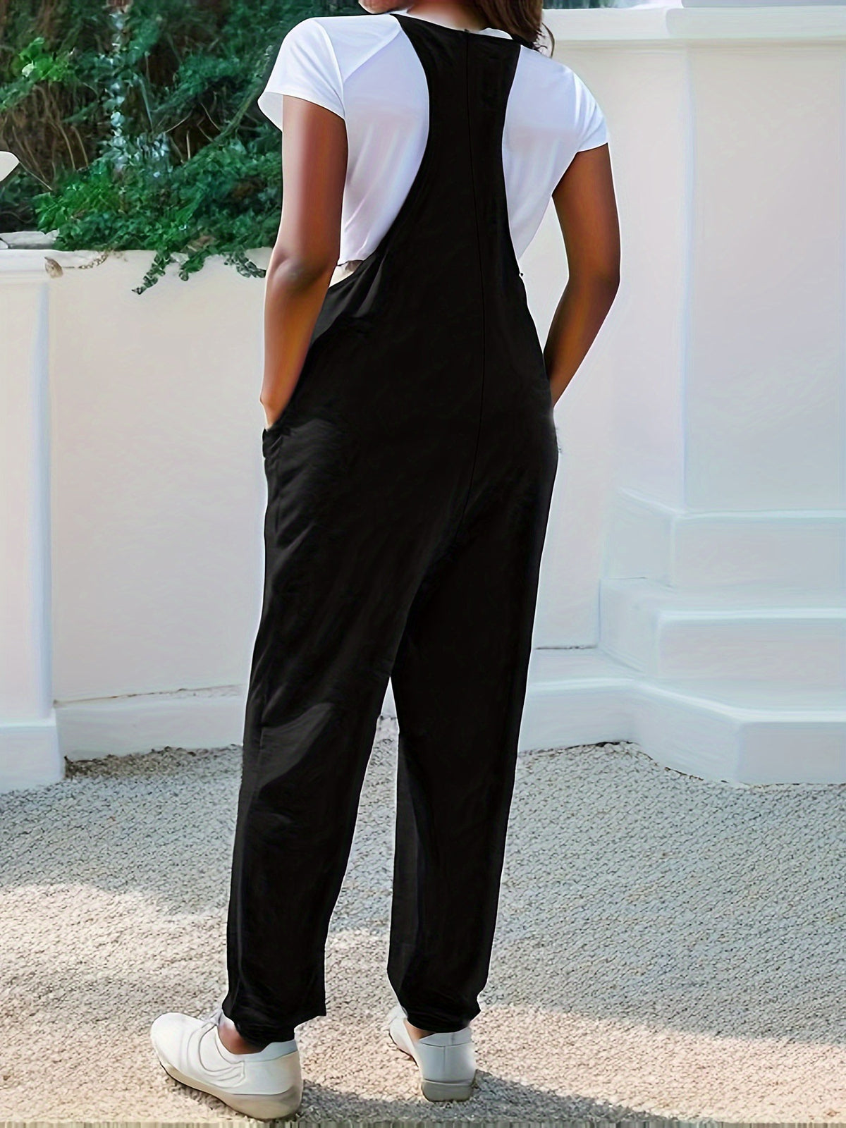 Plush Fashion Hub casual loose fit spaghetti strap jumpsuit with pockets, lightweight and comfortable for everyday wear.